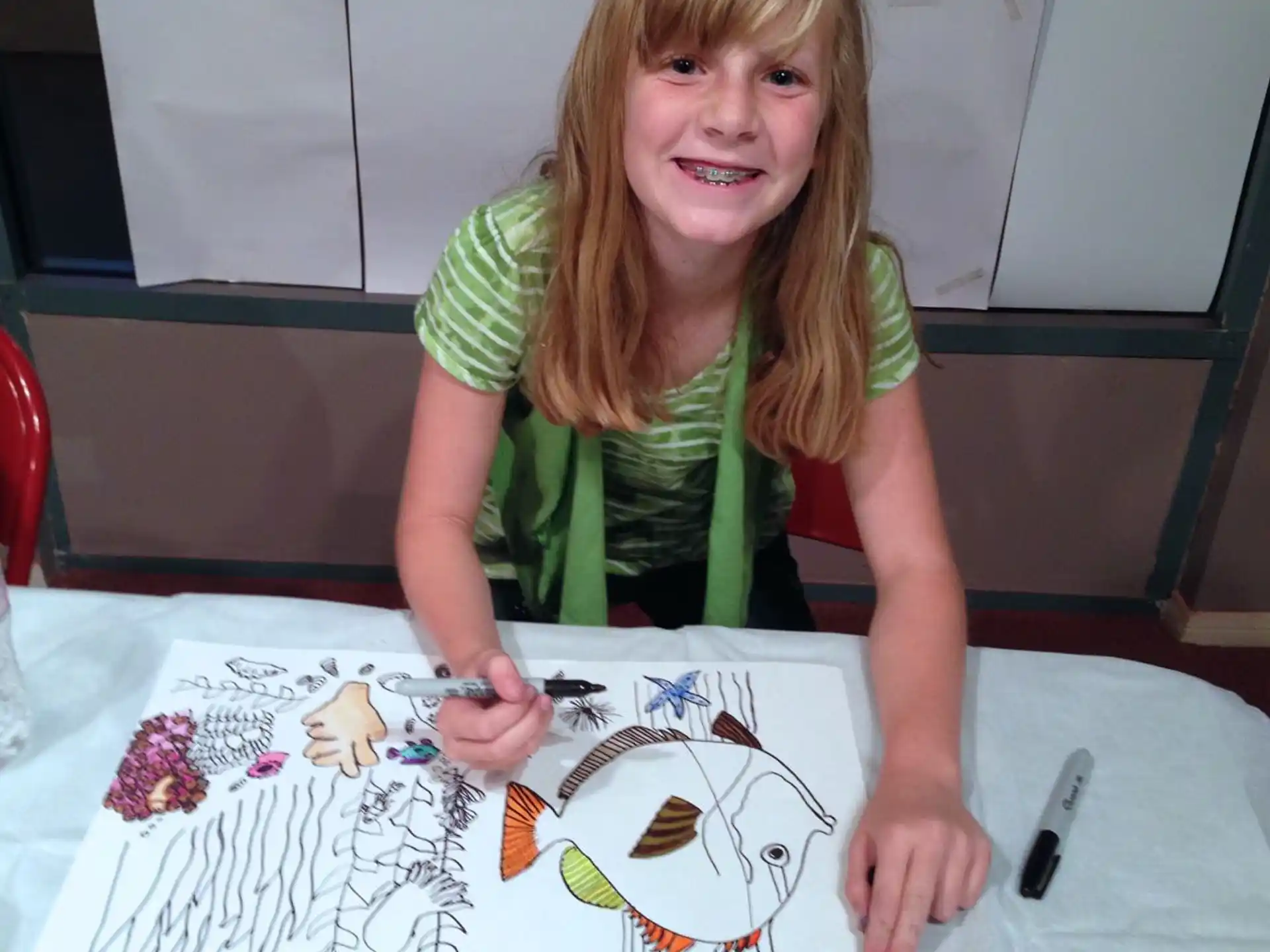 a person painting on a table