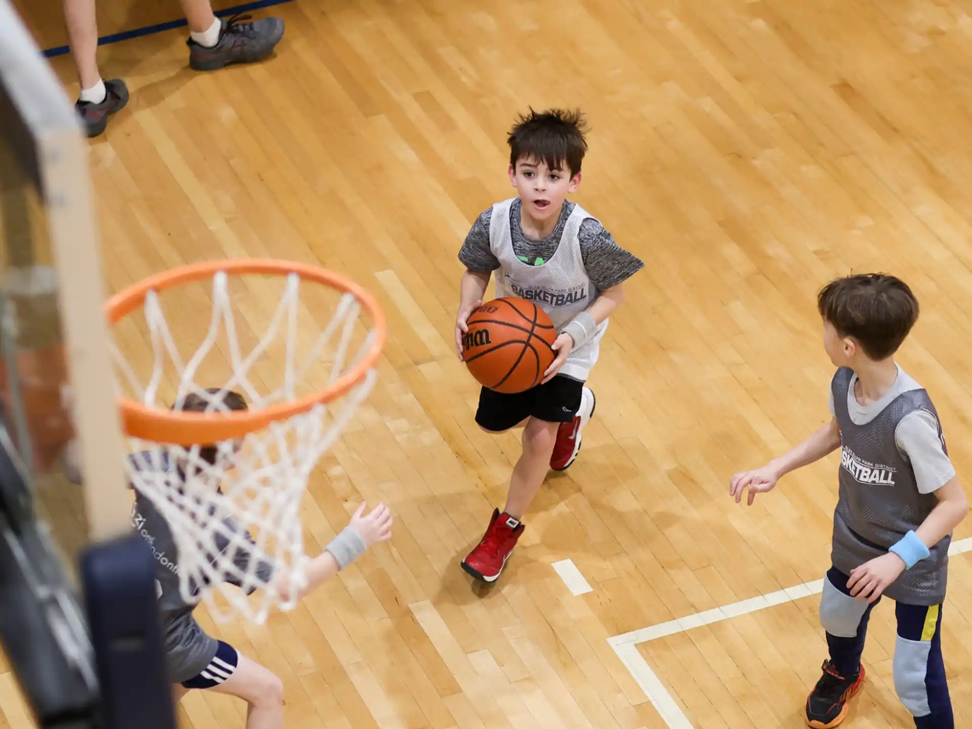 a couple of boys playing basketball