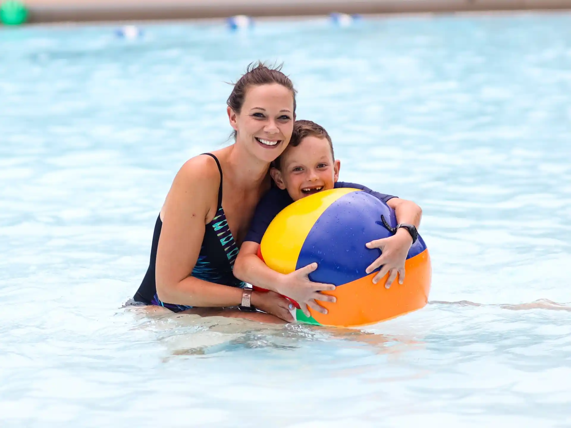 a woman and a child in the water