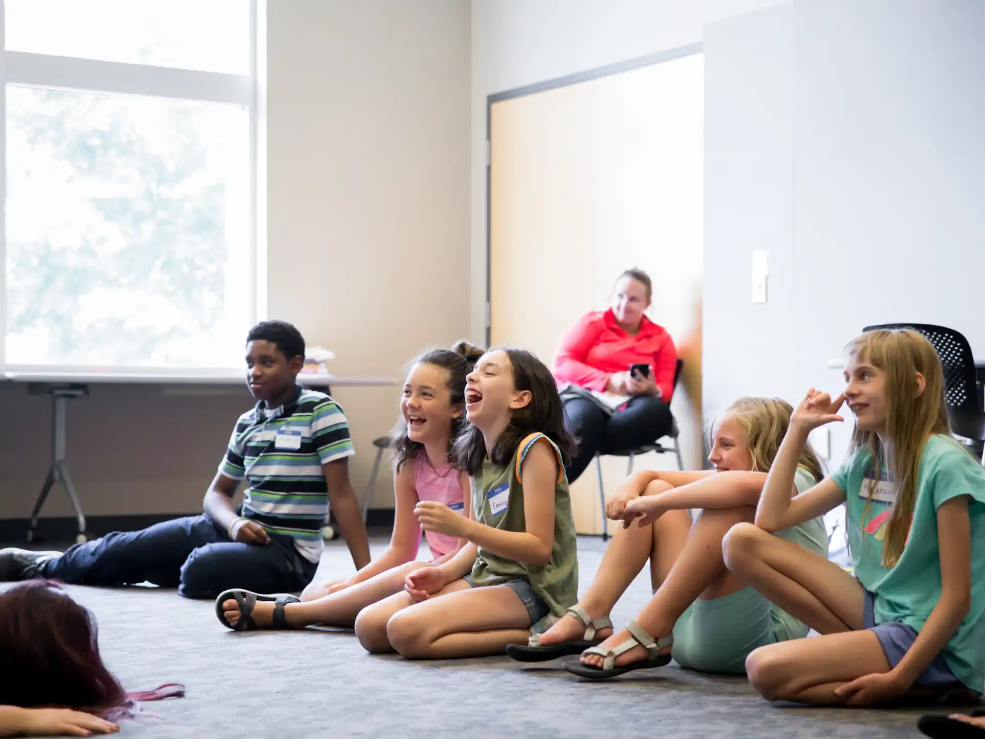 a group of people sitting on the floor