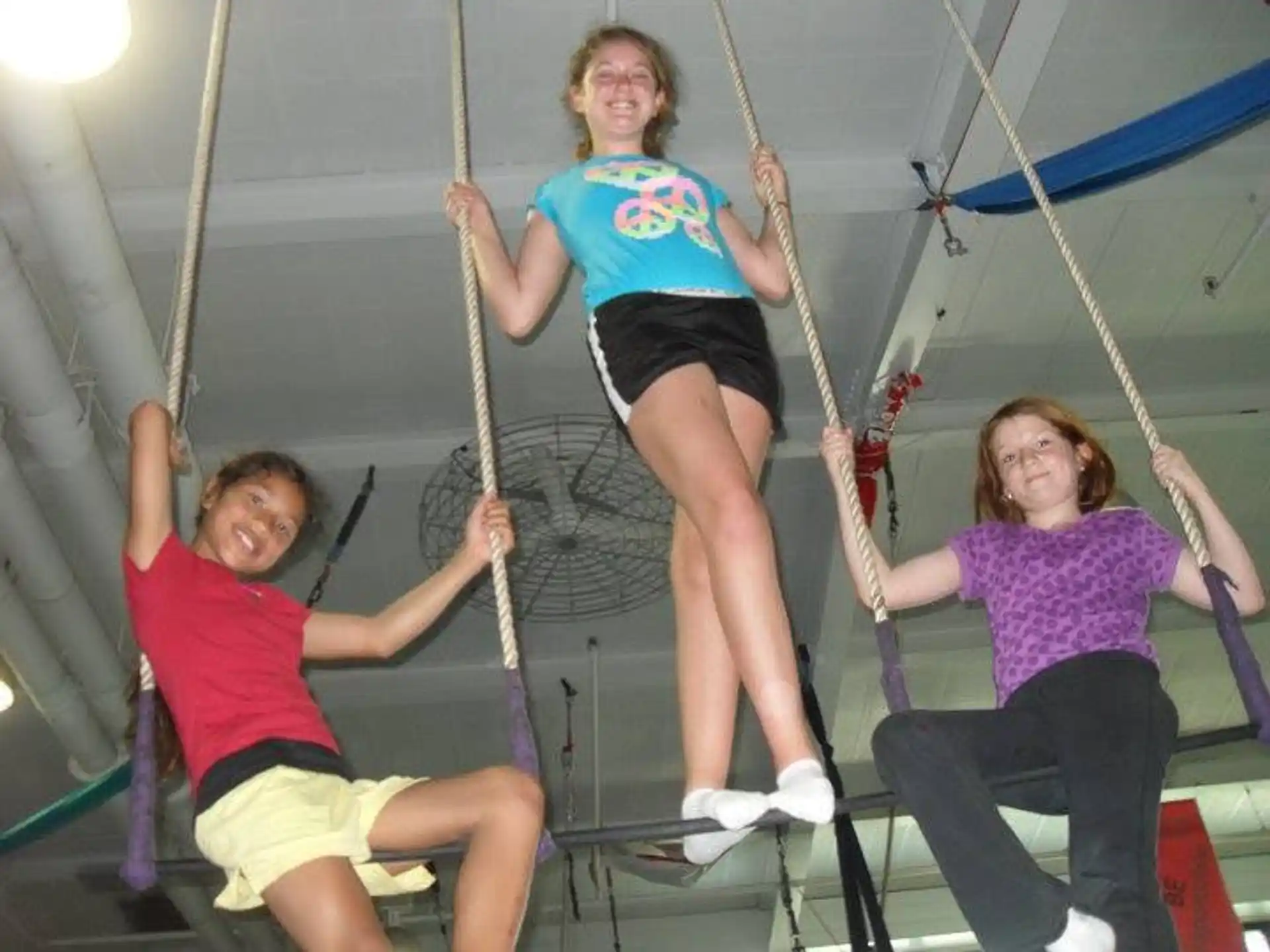 a group of people on ropes