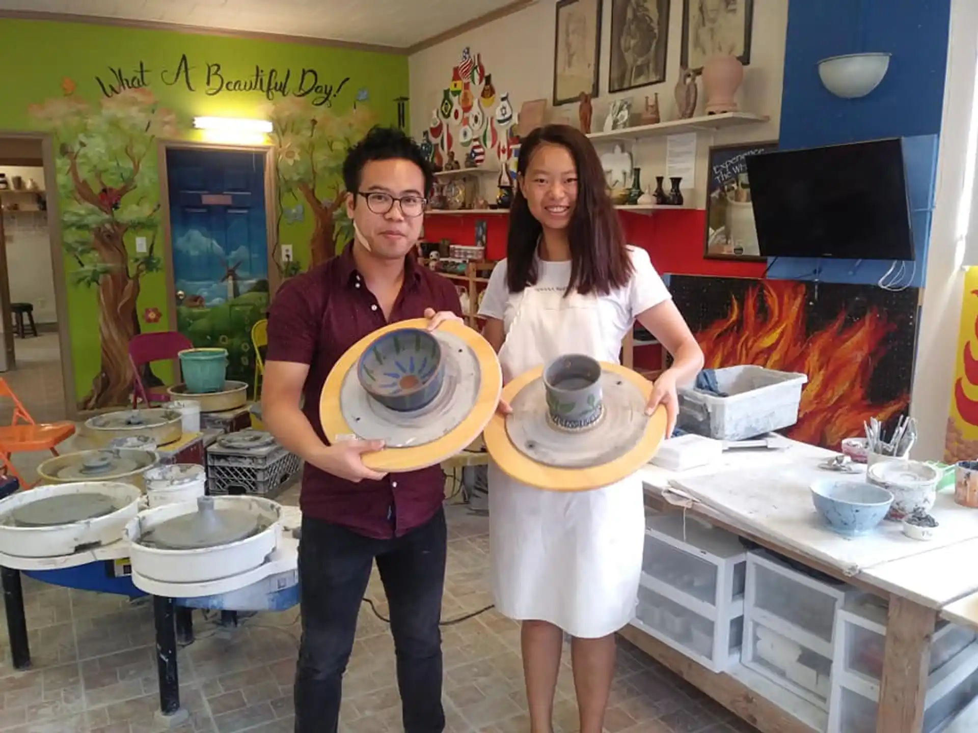 a man and woman holding plates