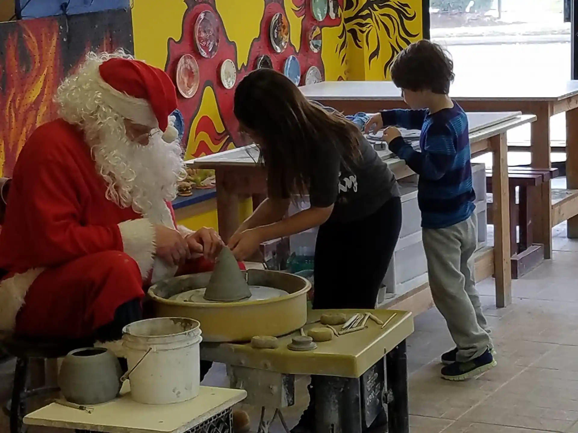a person and a child cooking in a kitchen