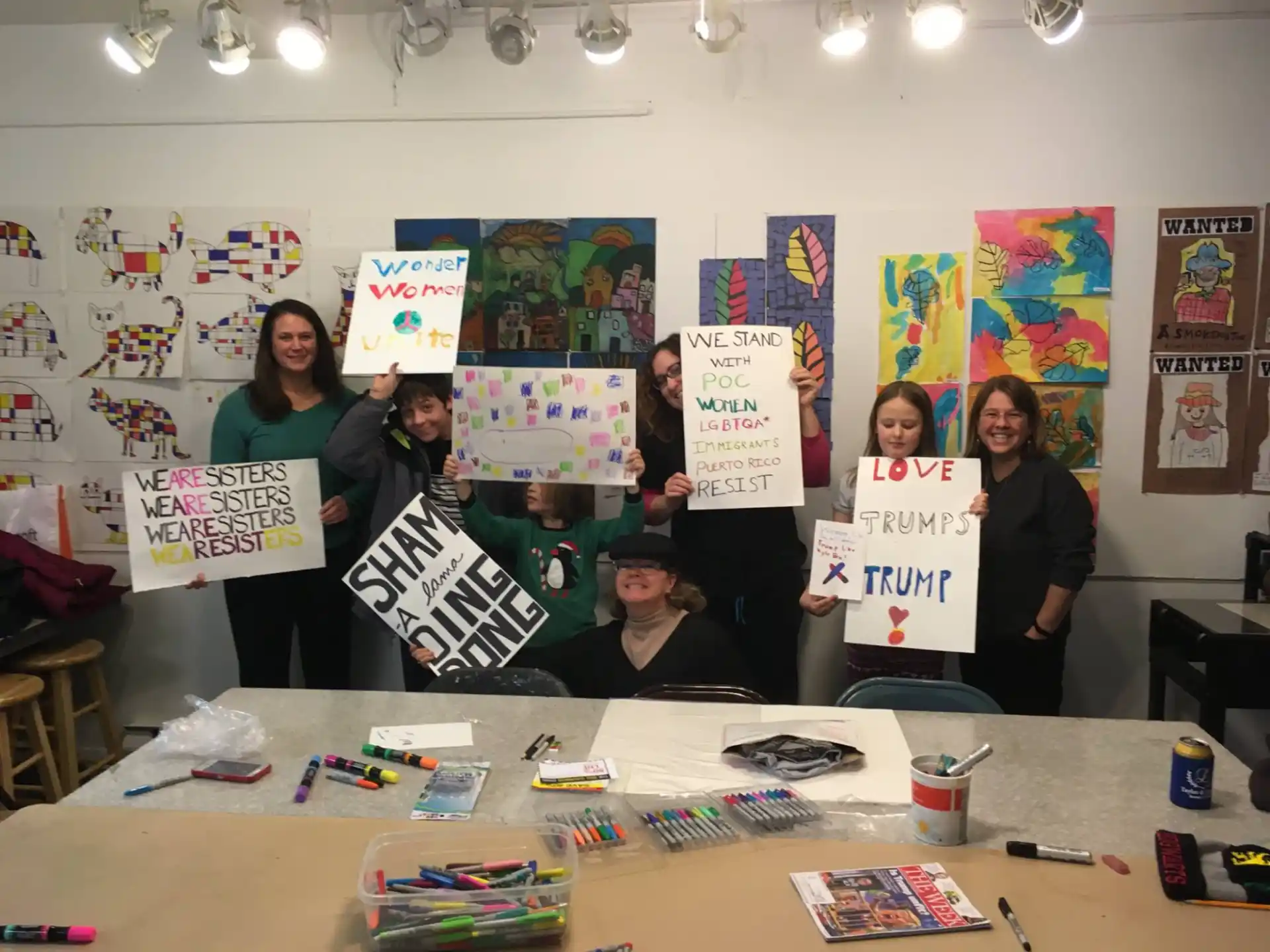 a group of people holding signs