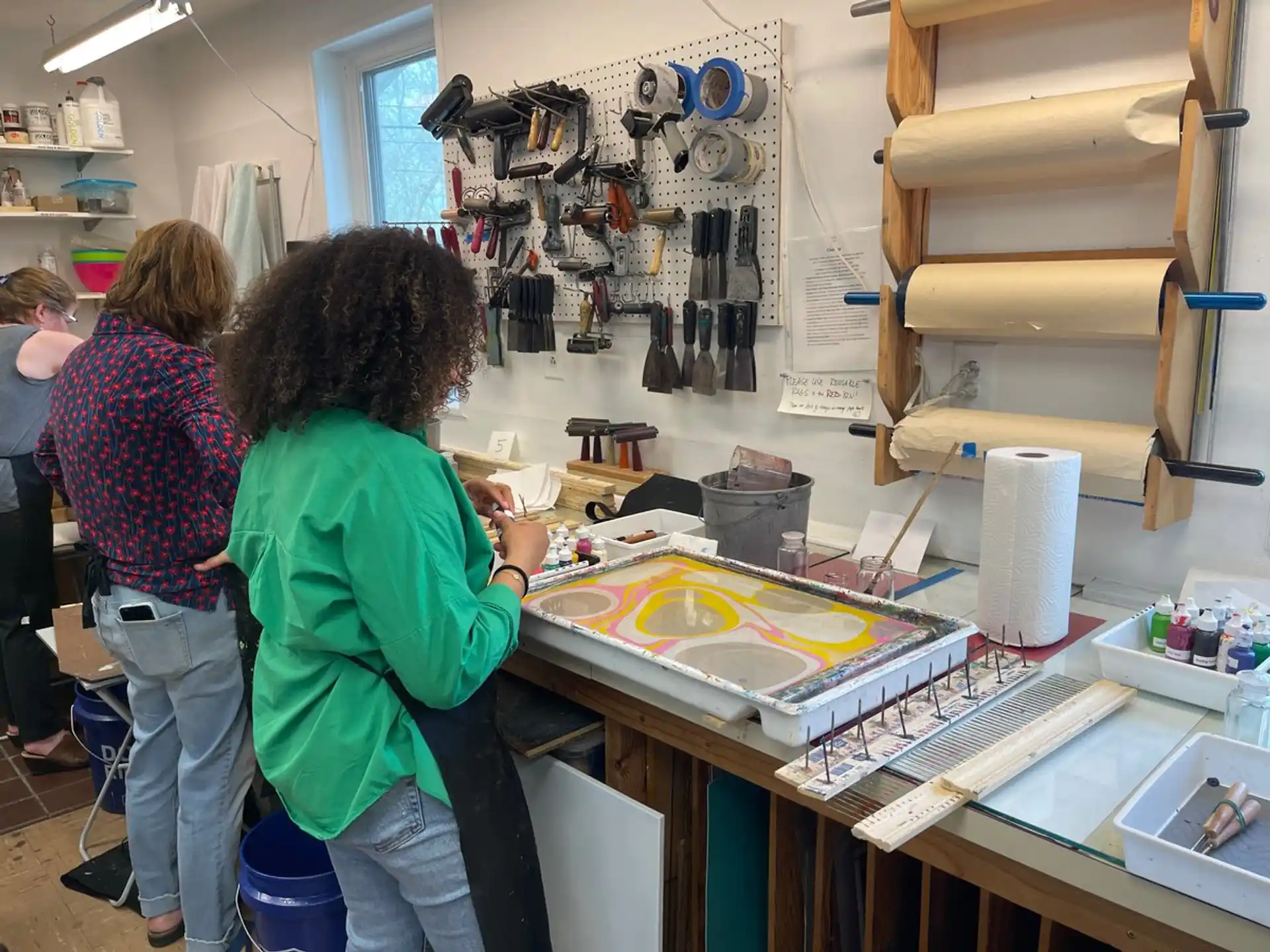 a group of people working in a shop