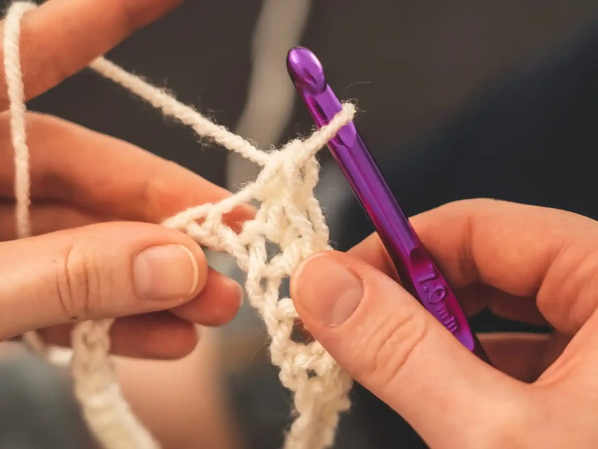 a person cutting a piece of string