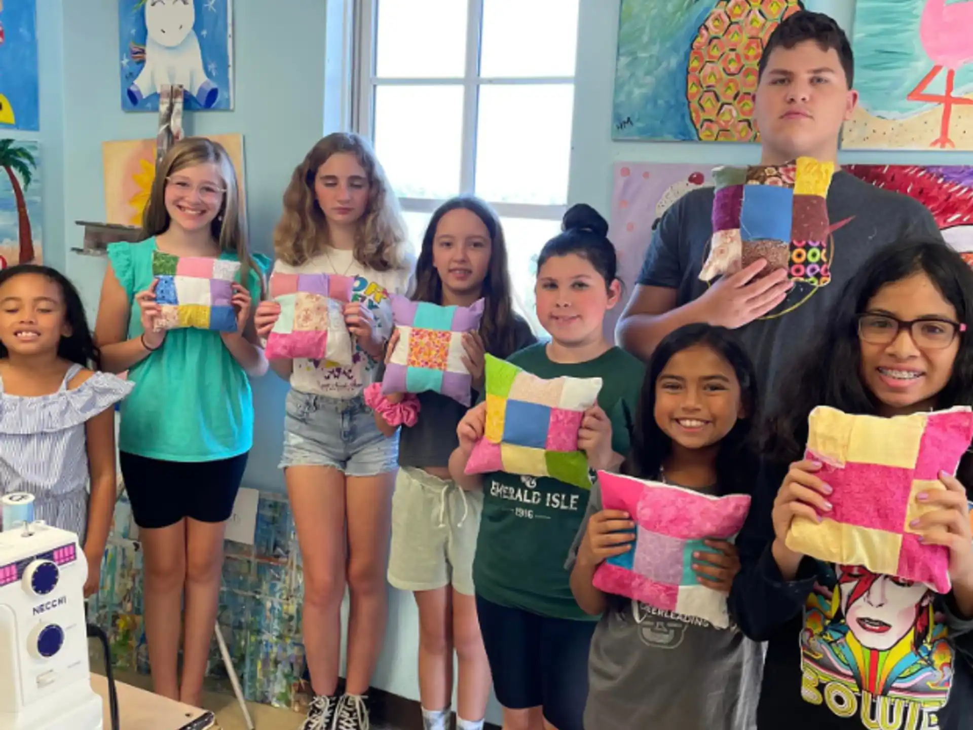 a group of children holding up books