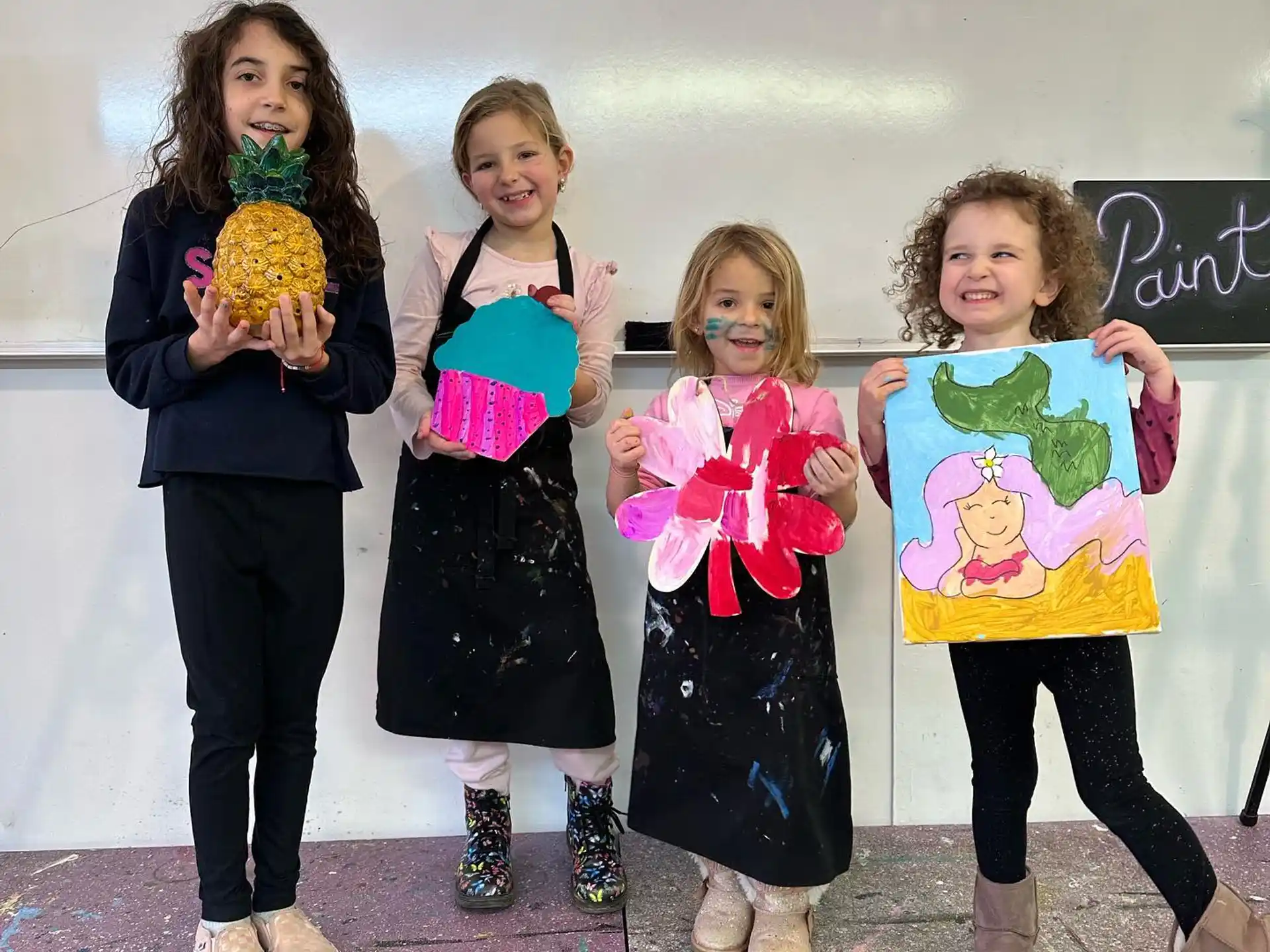 a group of girls holding flowers
