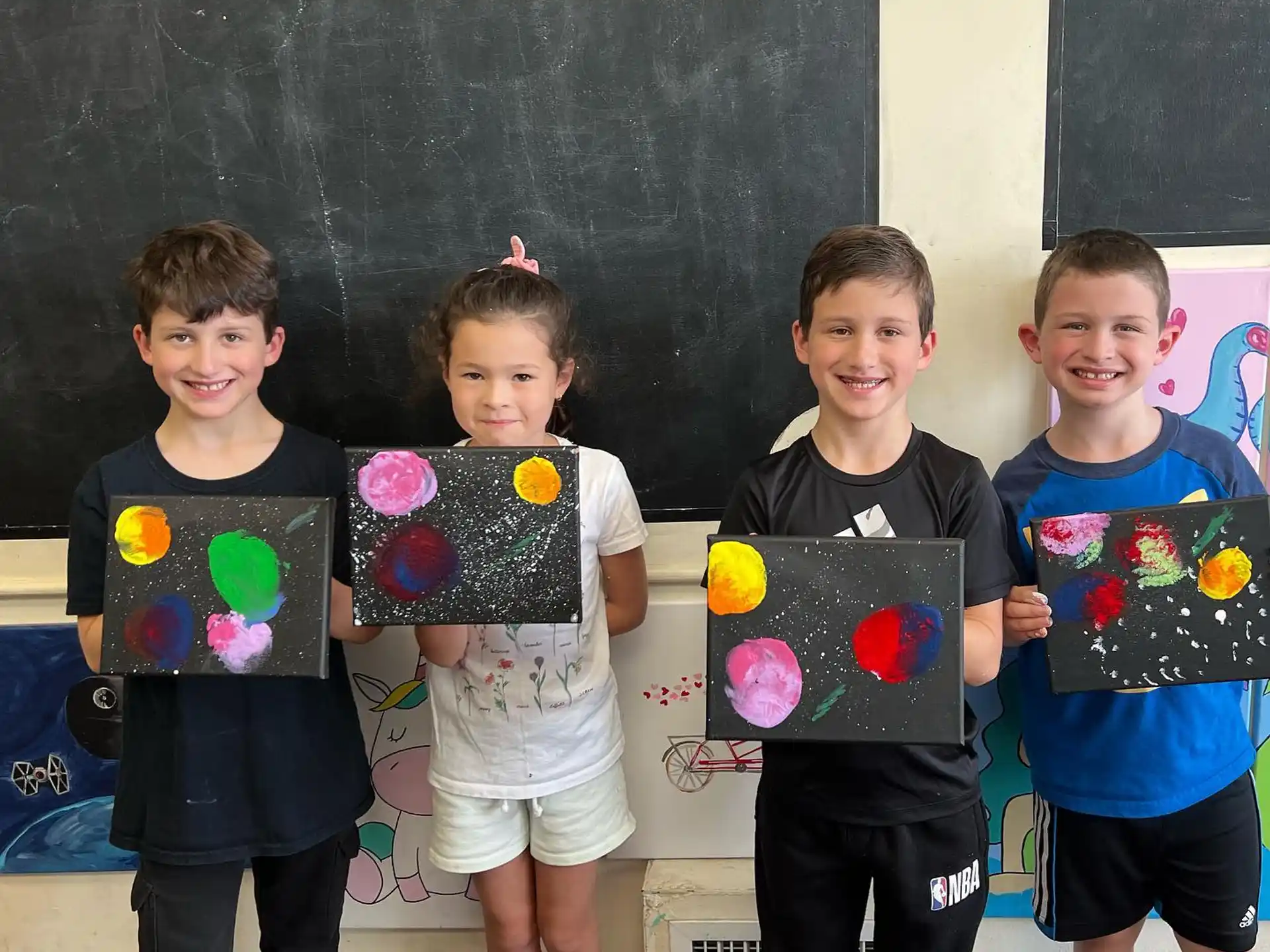 a group of kids holding up a heart