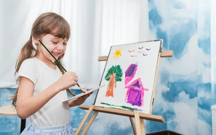a young girl painting