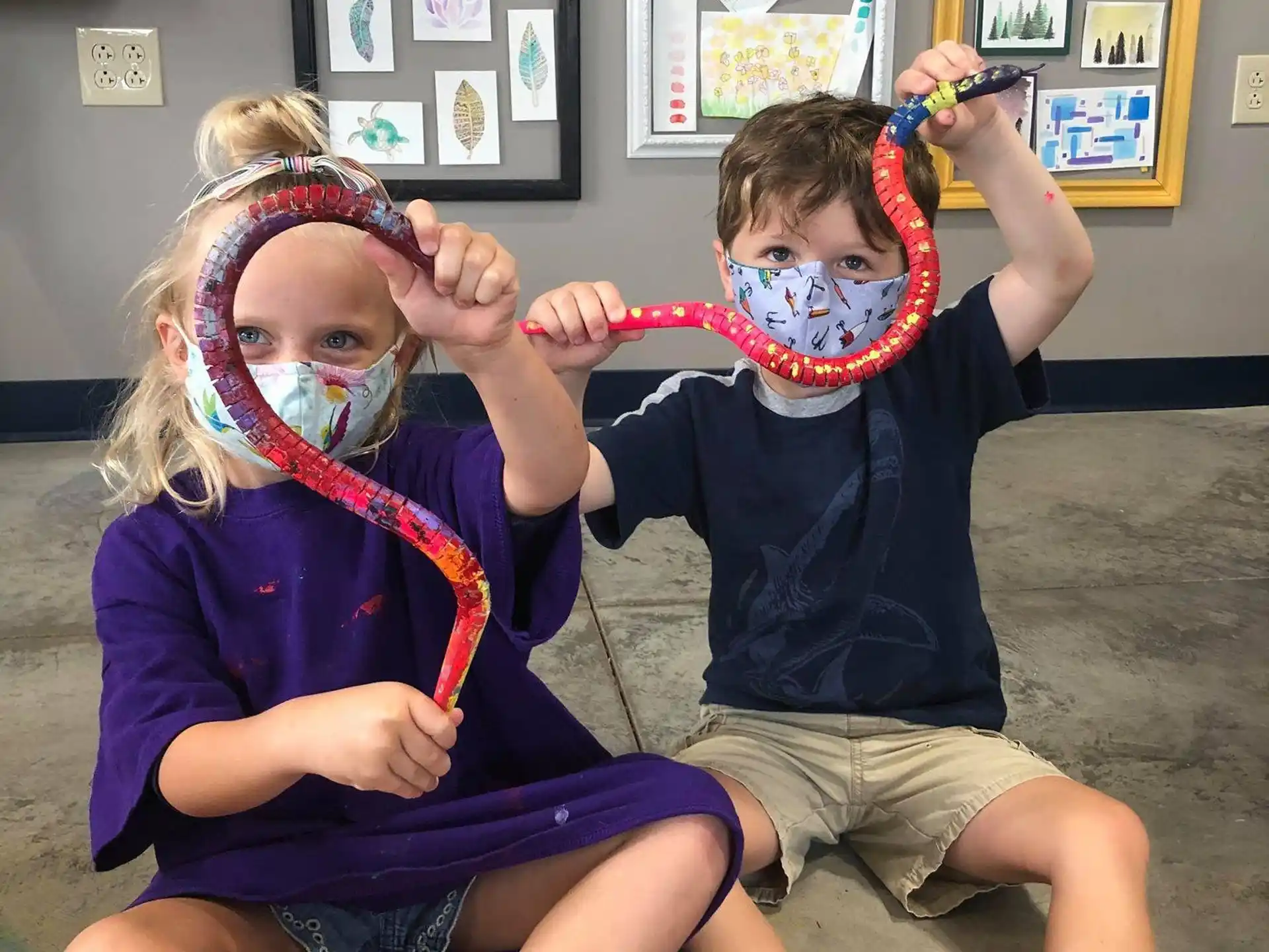 a couple of kids with paint on their faces