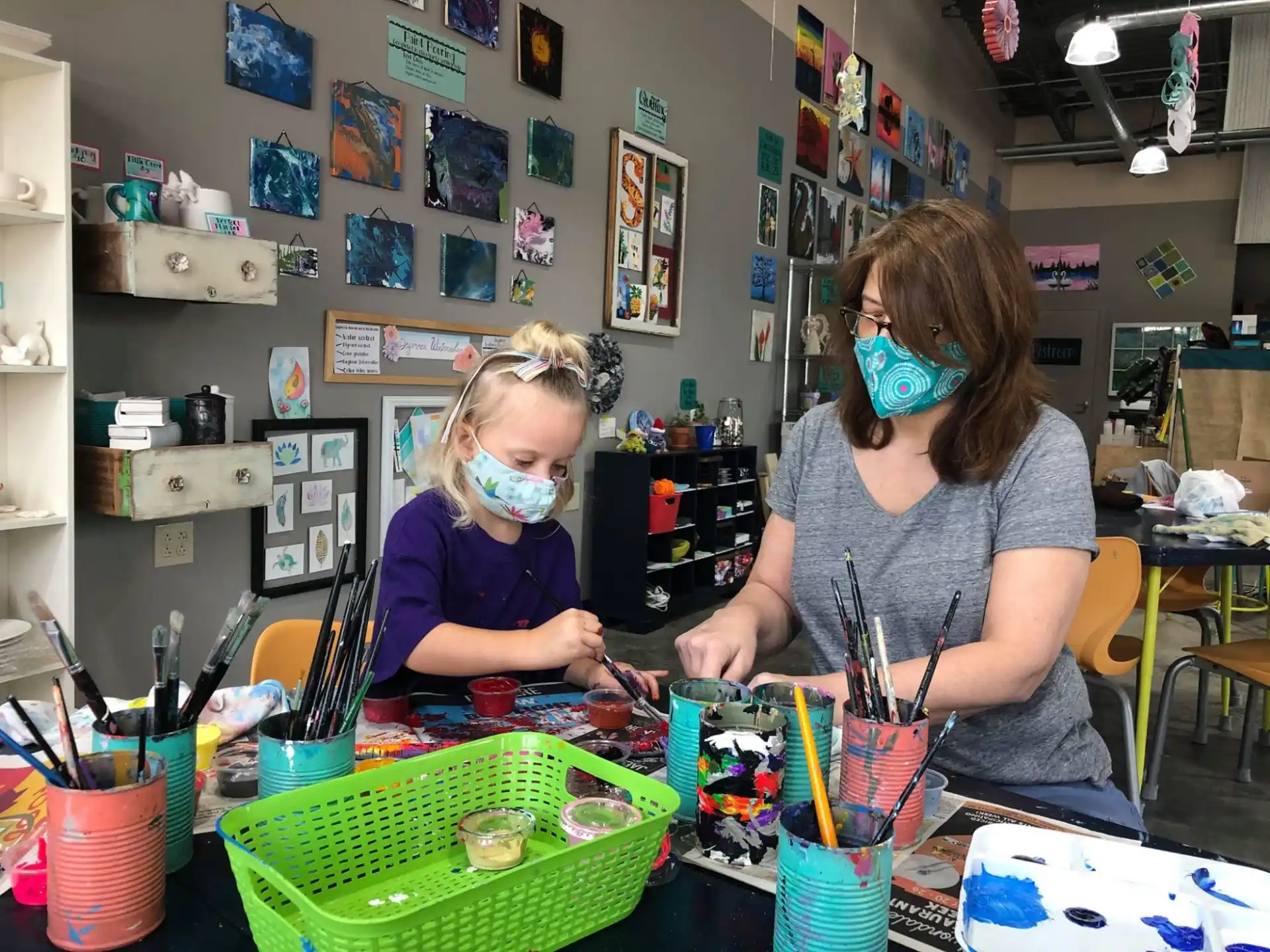 a person and a child wearing masks