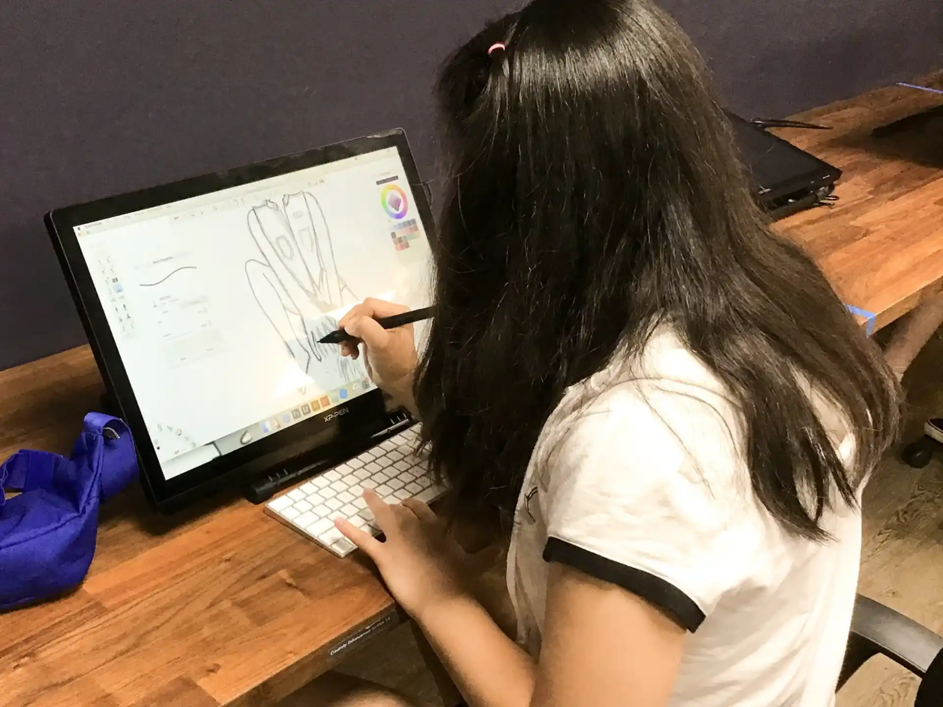 a woman writing on a white board
