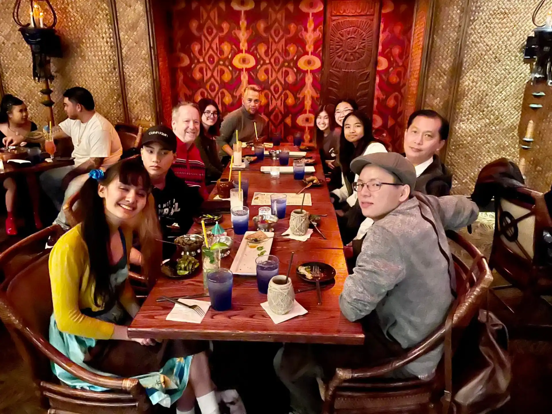 a group of people sitting around a table