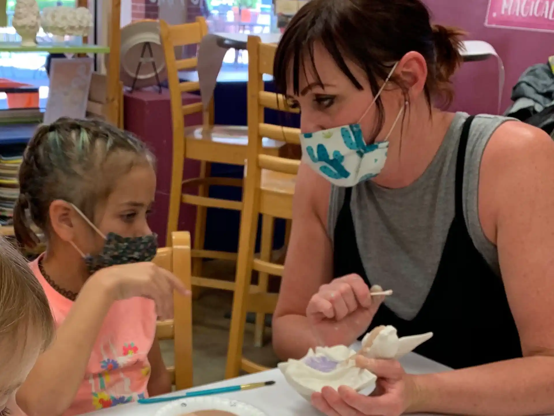 a woman feeding a child