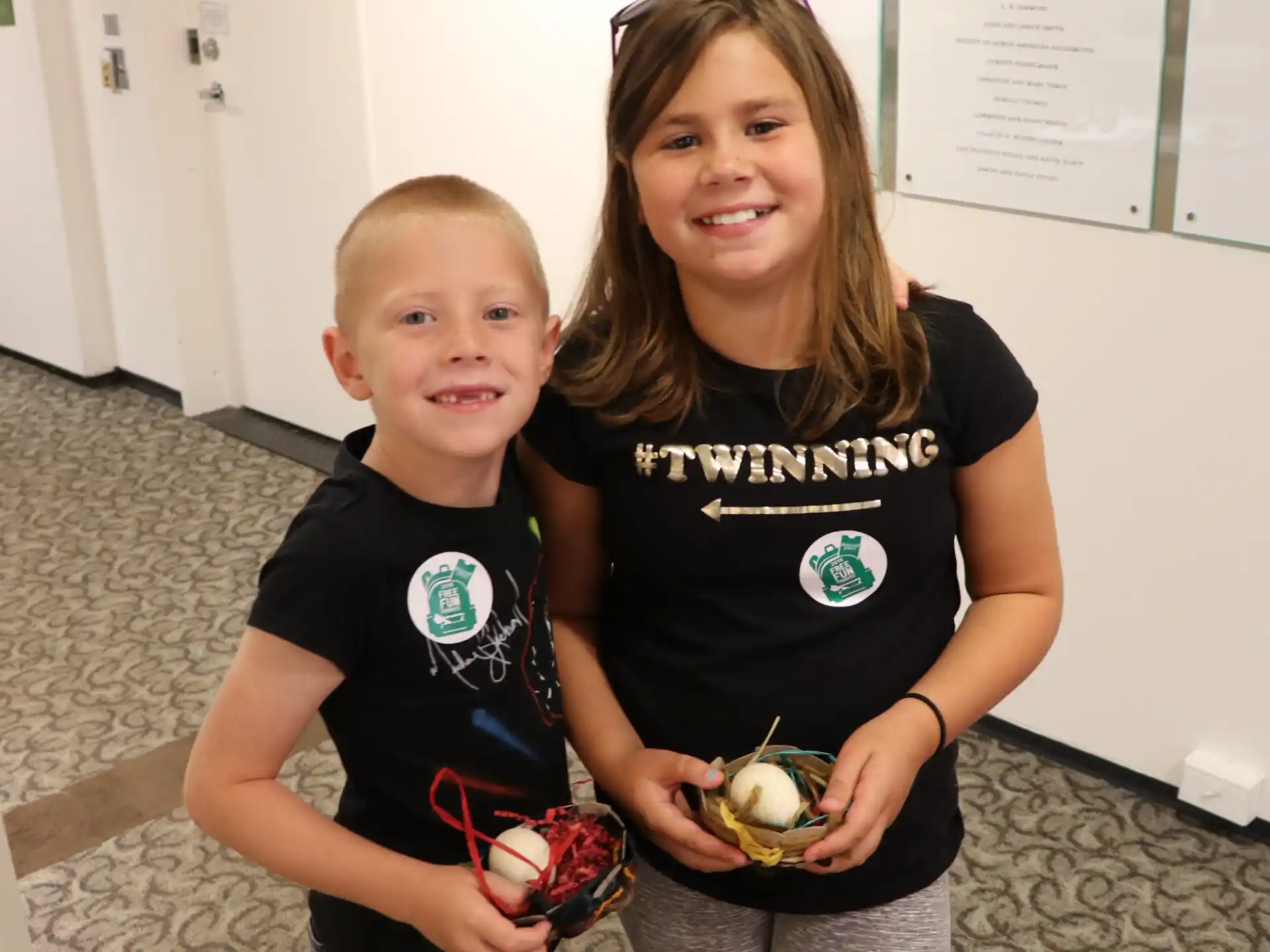 a person and a boy holding food