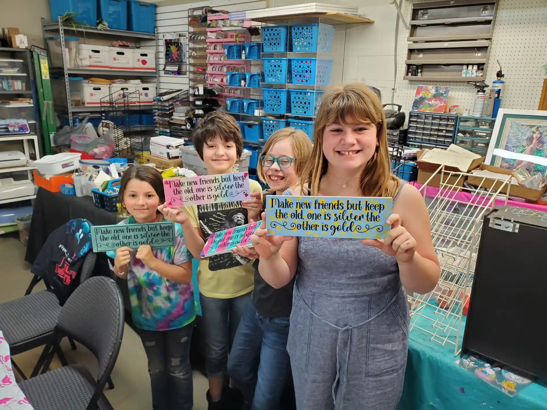a group of children holding up signs