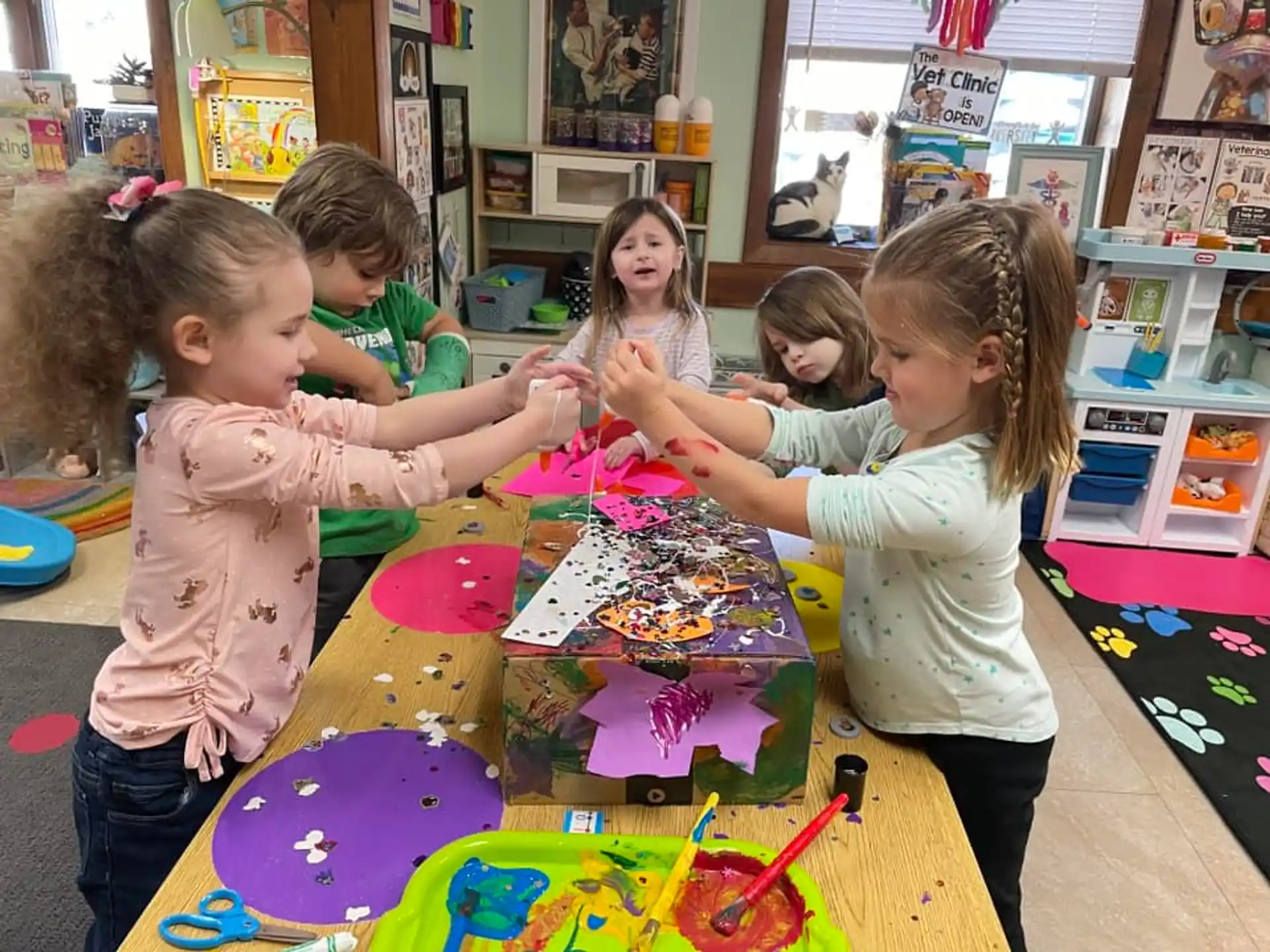 a group of children playing with toys
