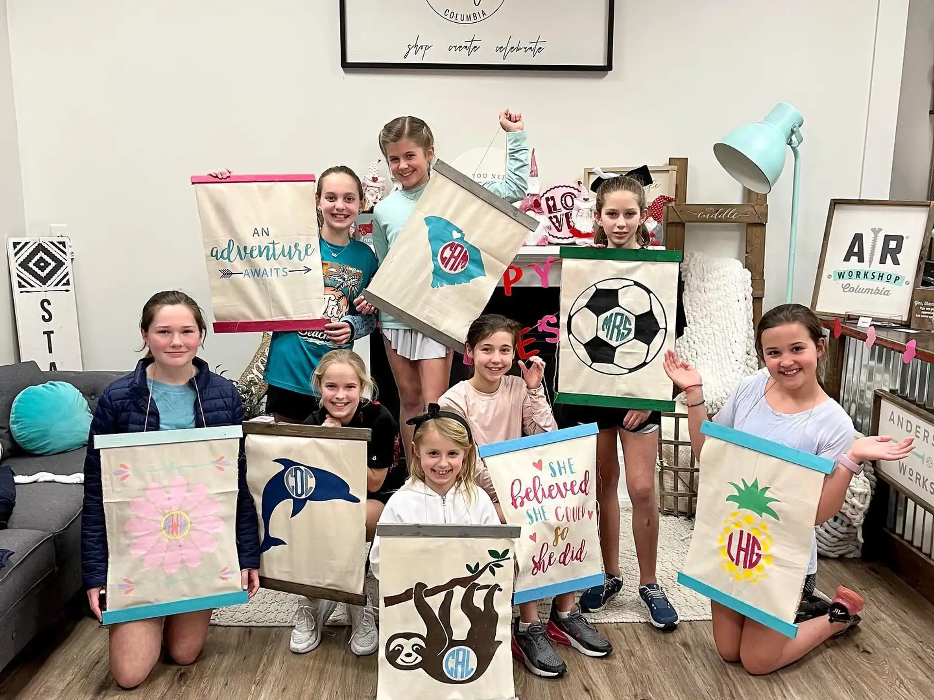a group of children holding up signs