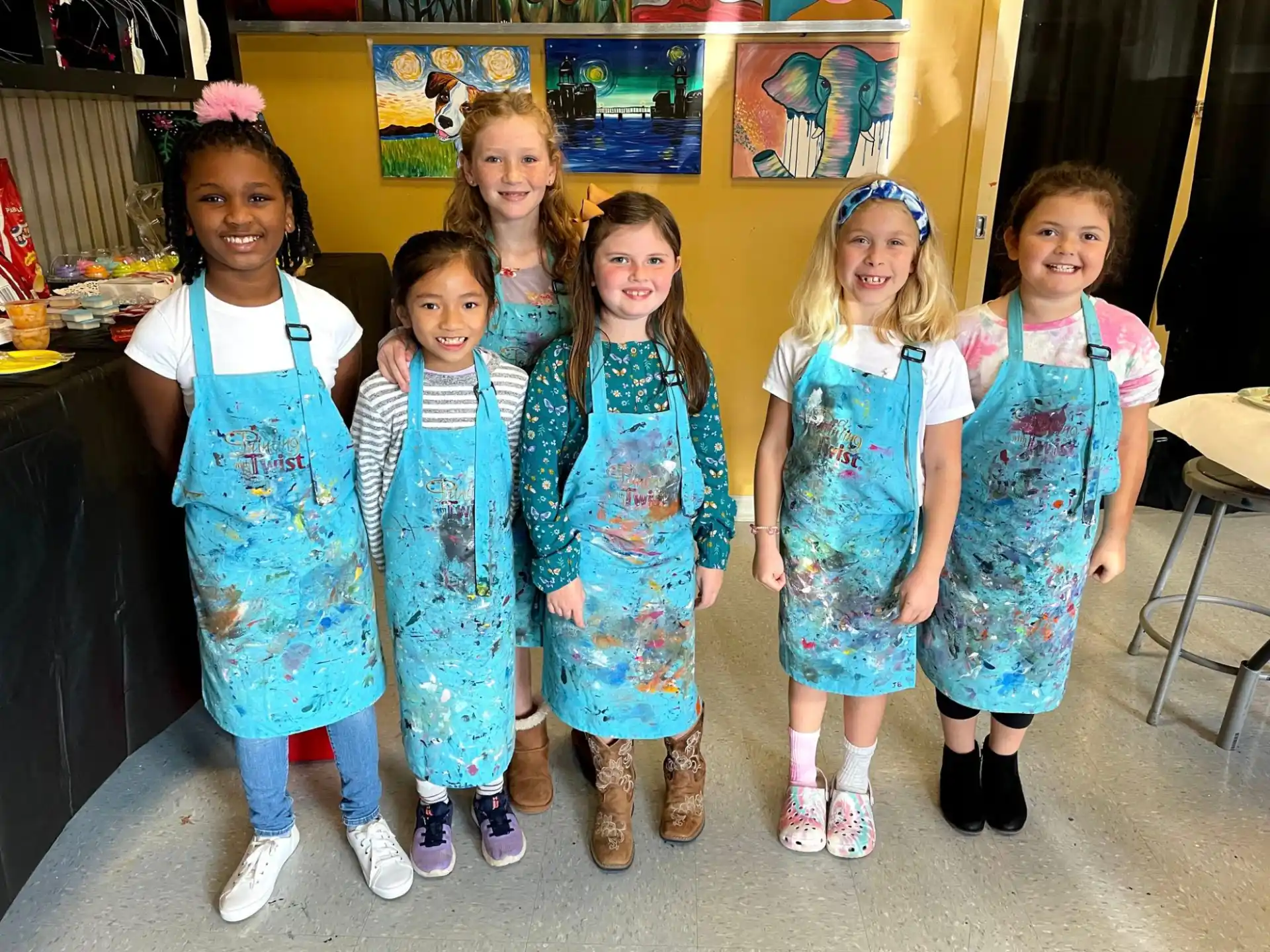 a group of girls in dresses