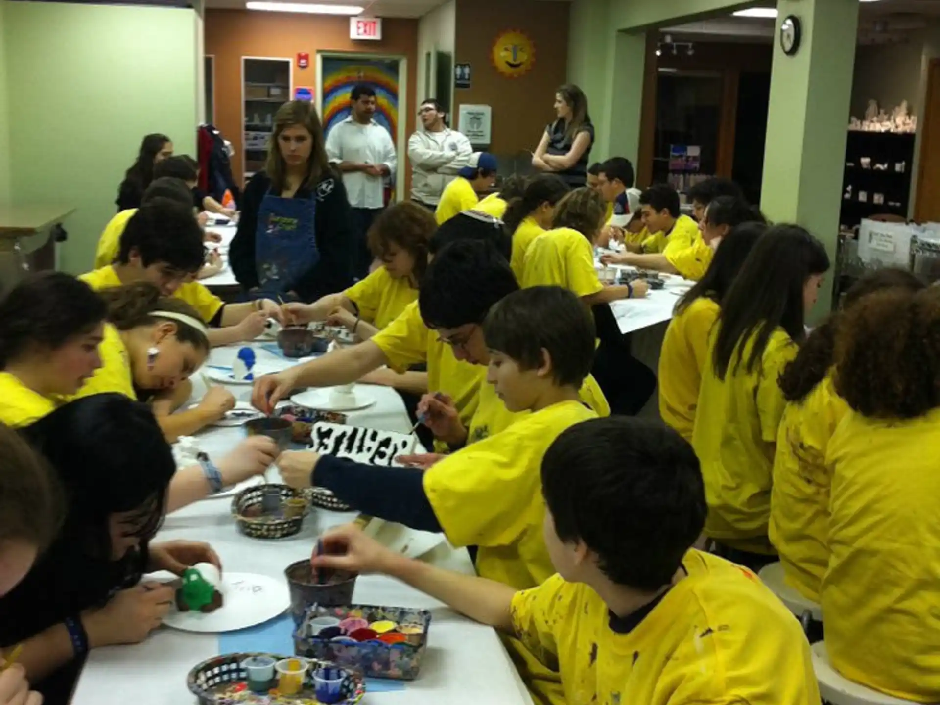 a group of children eating at a table