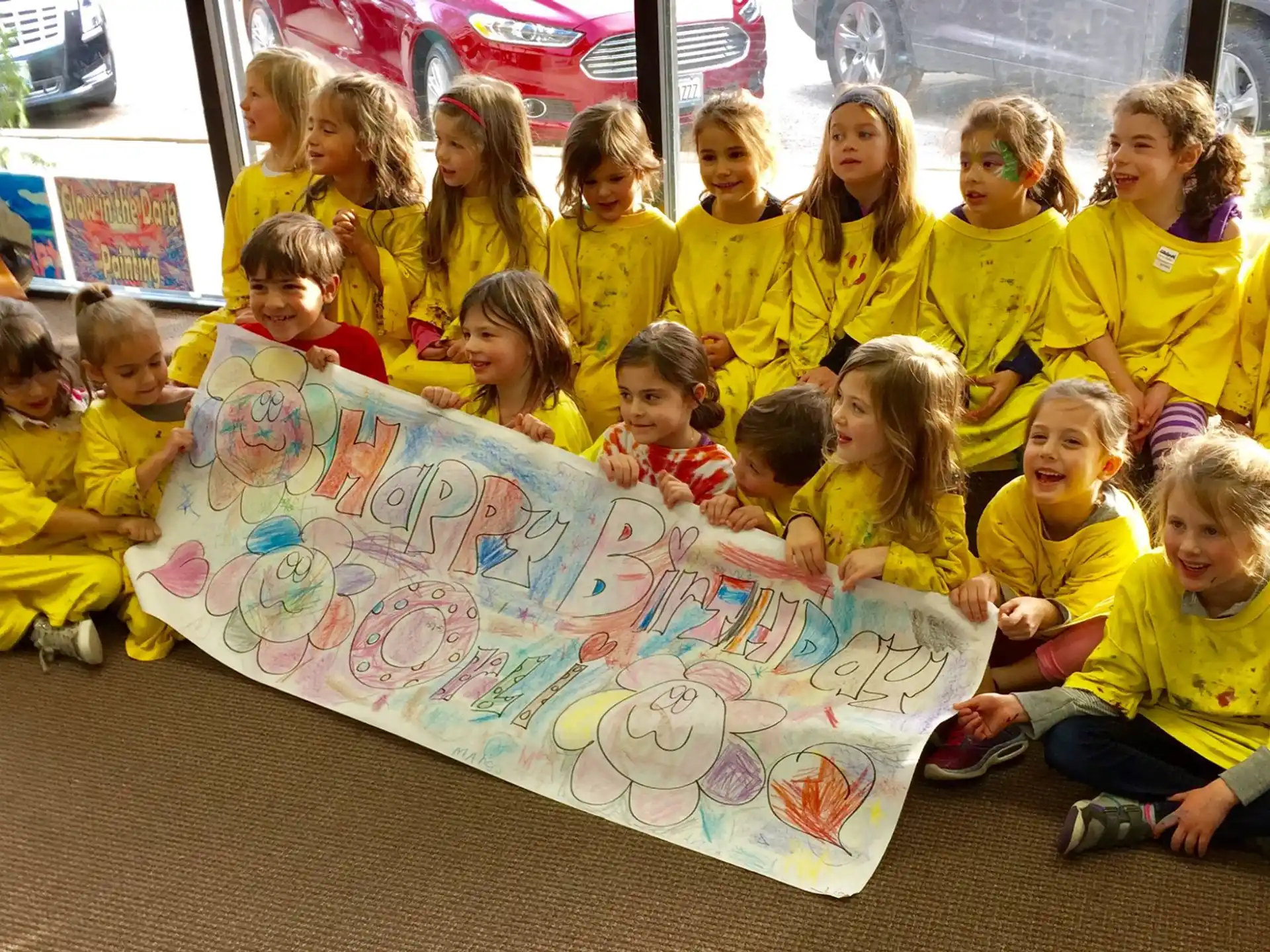 a group of children sitting on the floor
