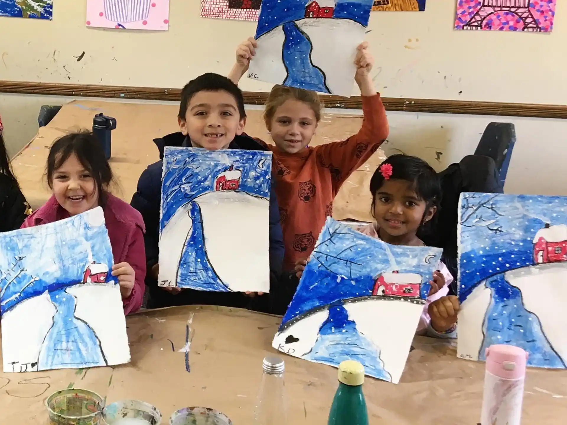 a group of girls holding up blue and white flags
