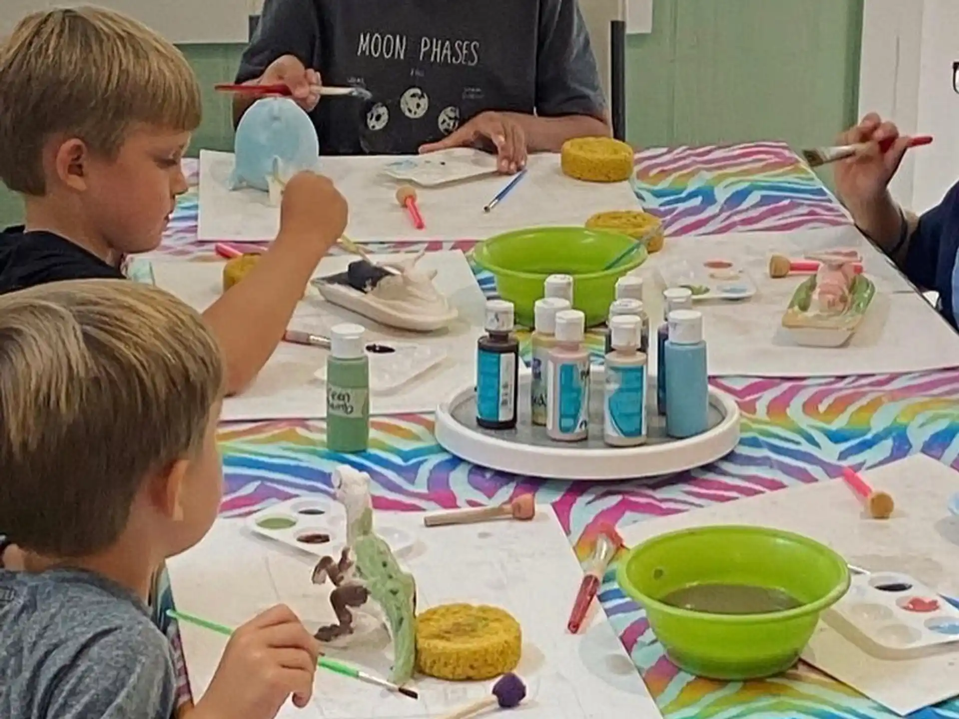 a group of children painting