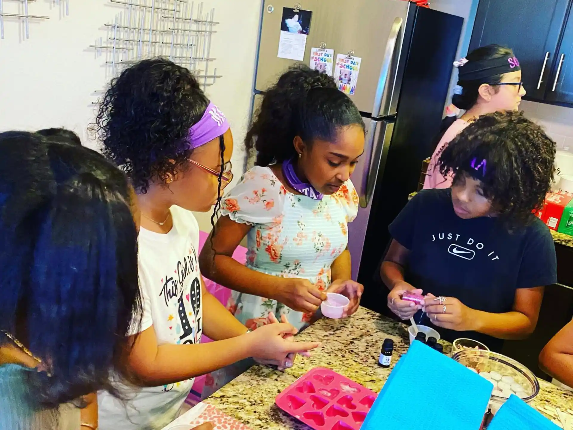 a group of people sitting at a table with a board game