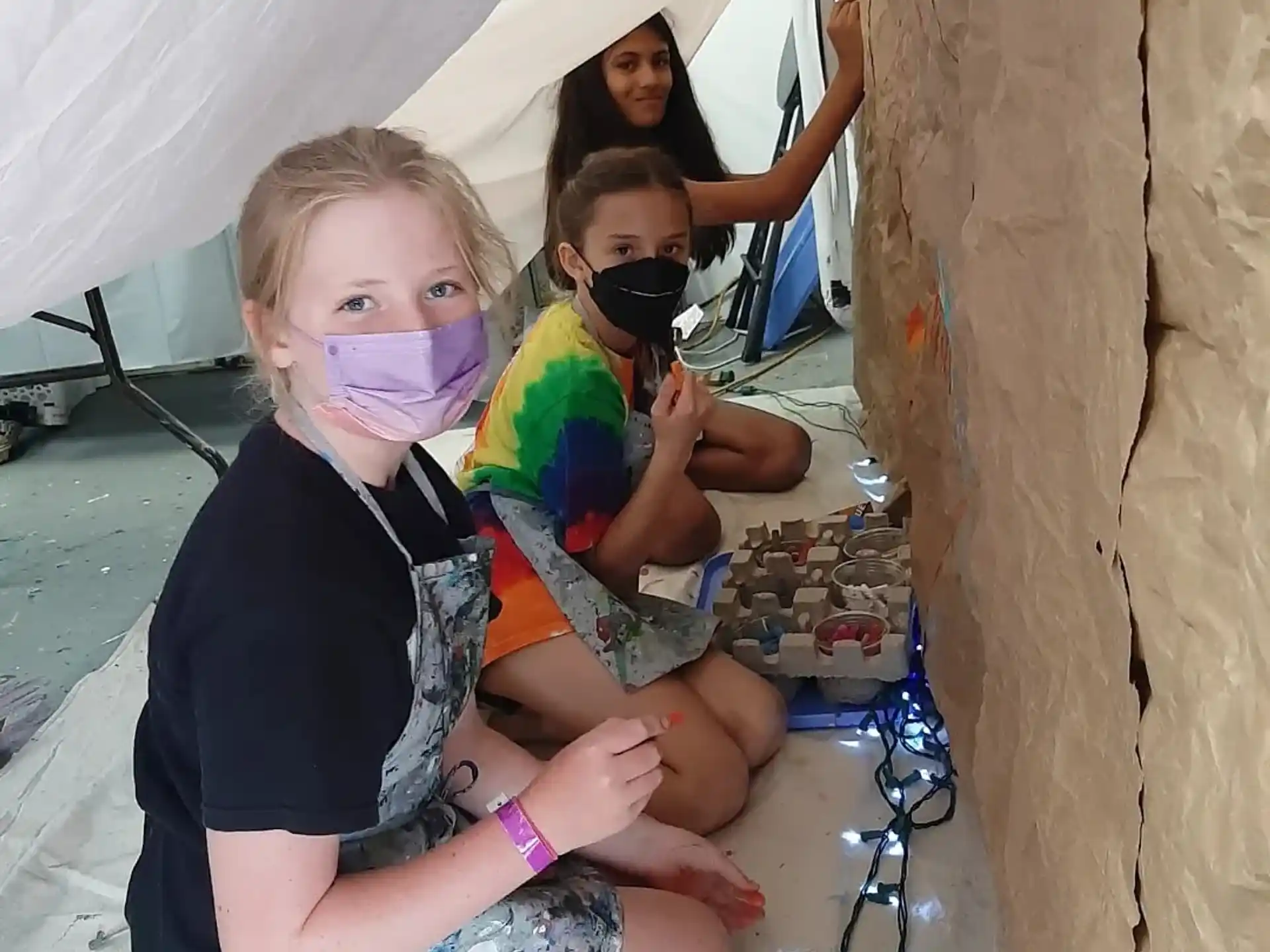 a group of people in a tent