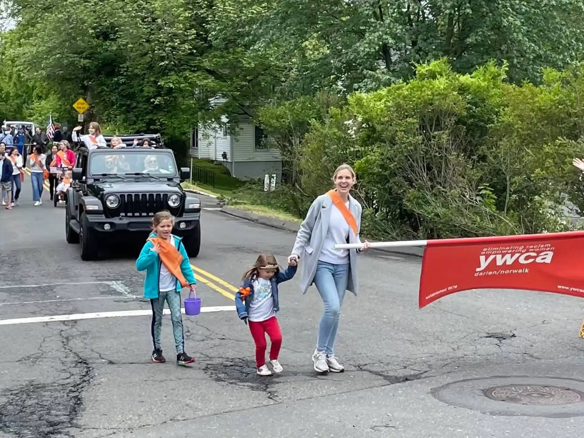 a group of people walking down a street
