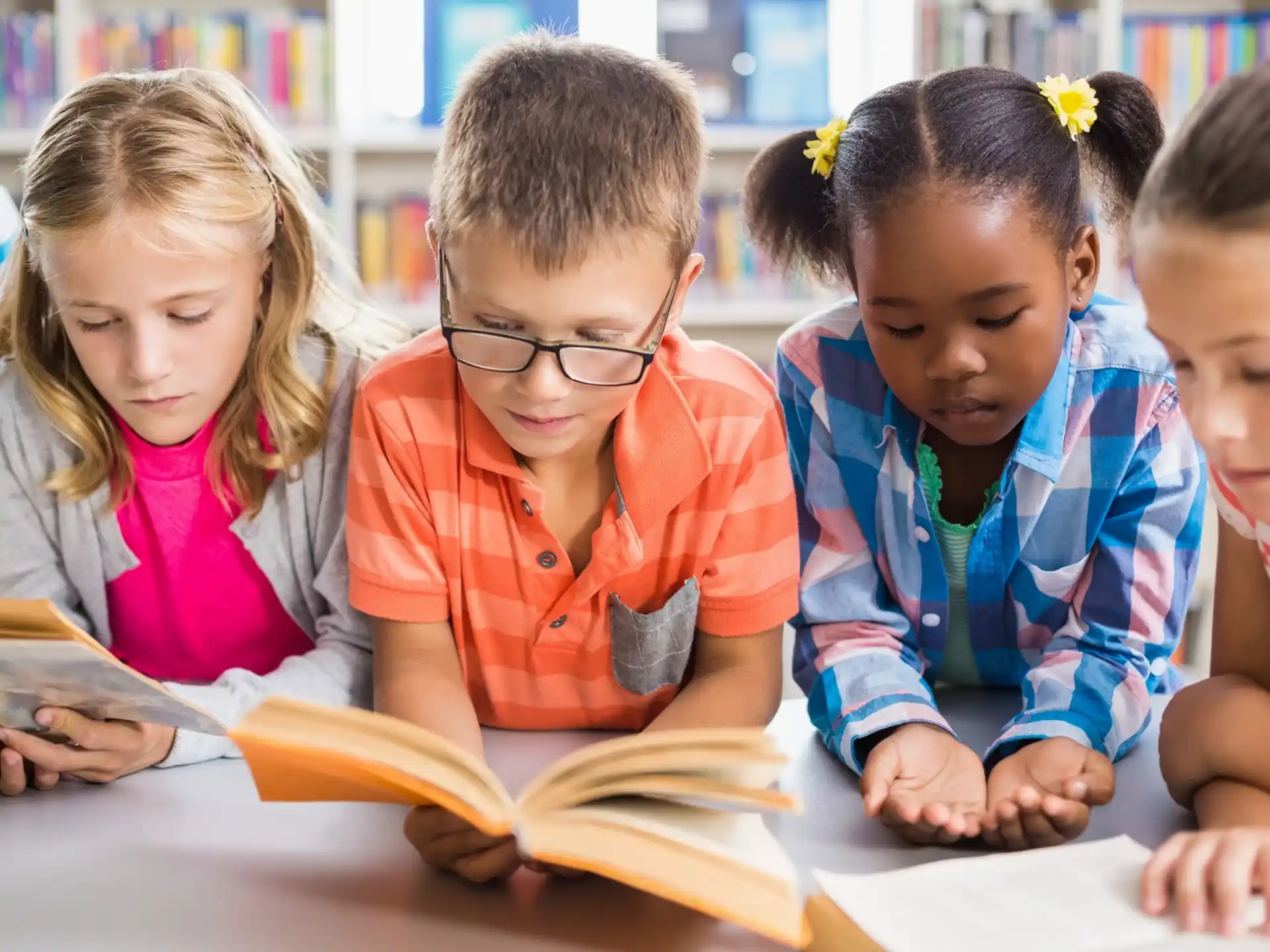 a group of children looking at a book