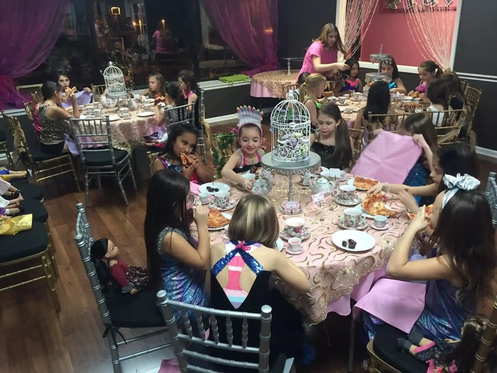 a group of people sitting at a table eating food
