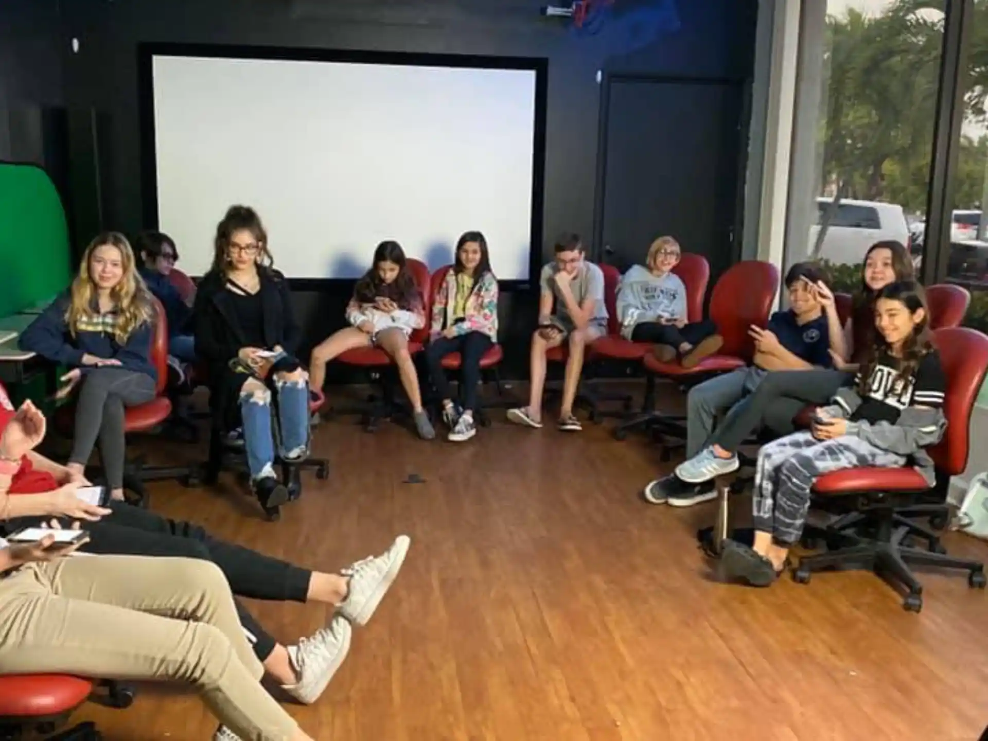 a group of people sitting in chairs