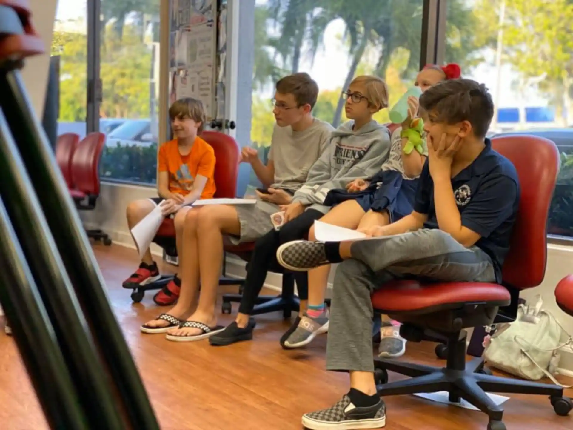 a group of people sitting in chairs