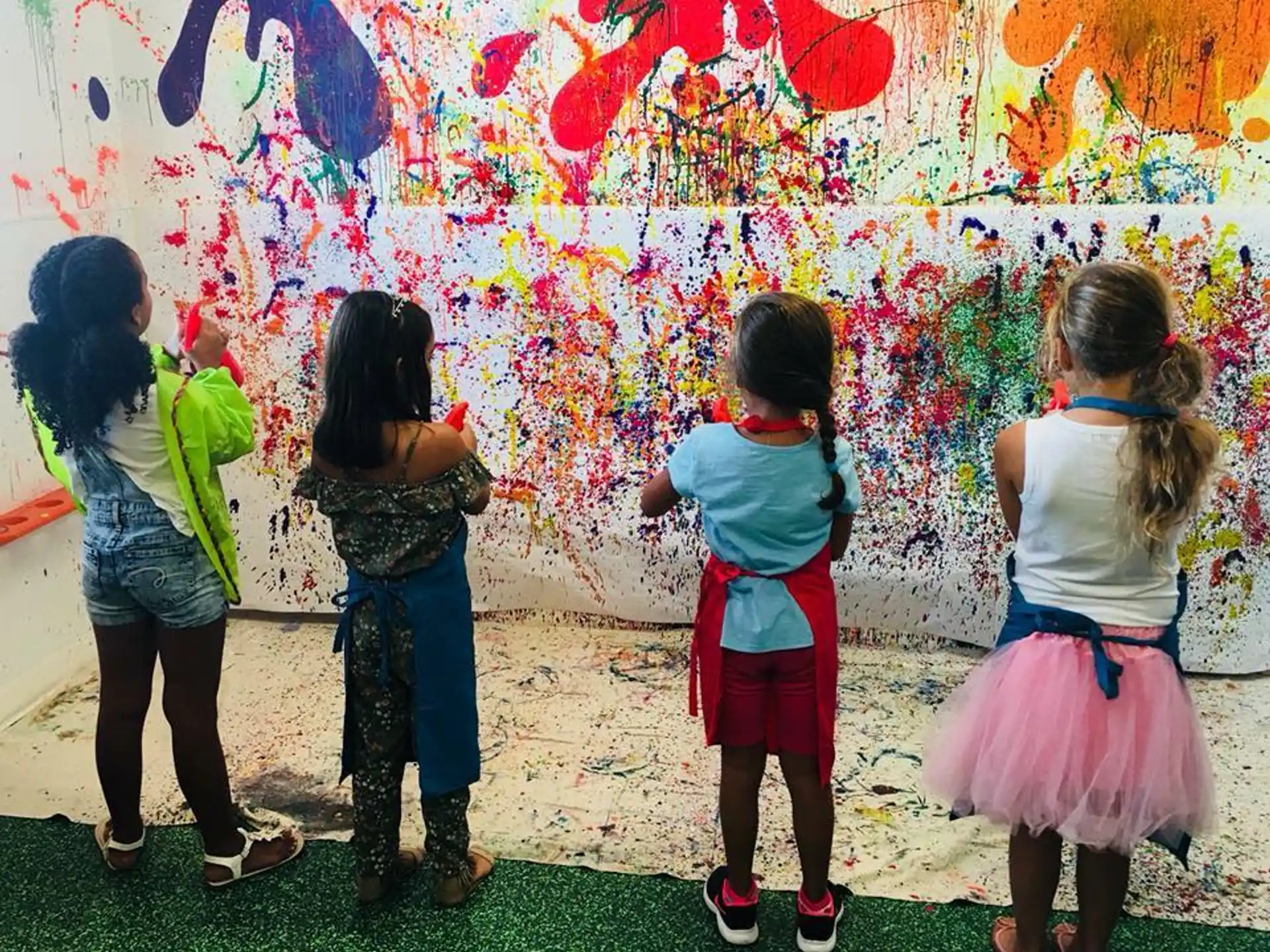 a group of children painting