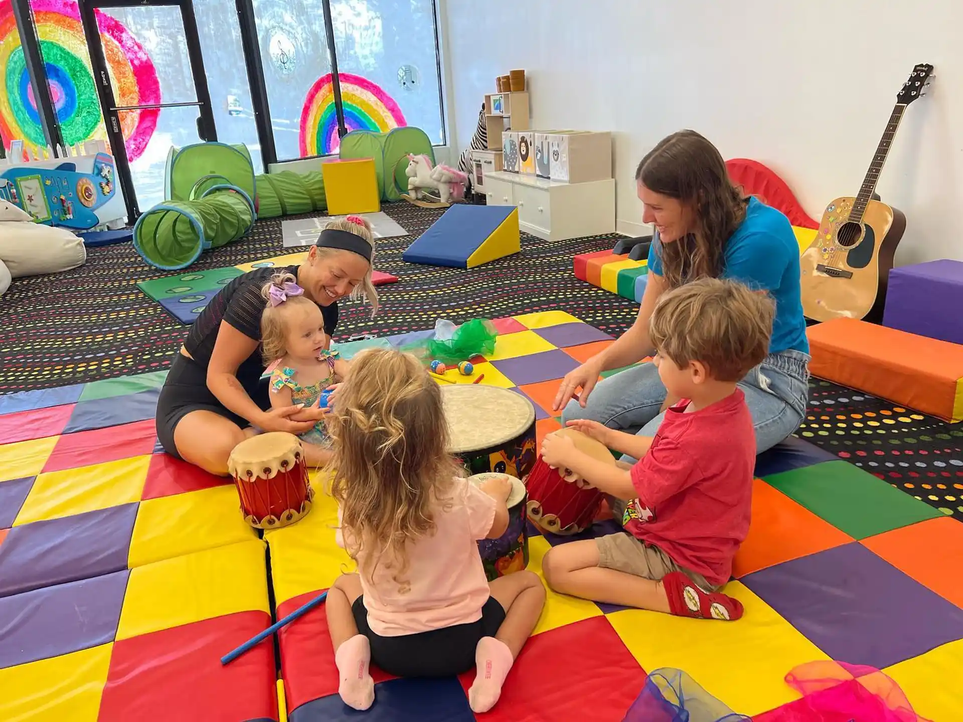 a group of children sitting on the floor