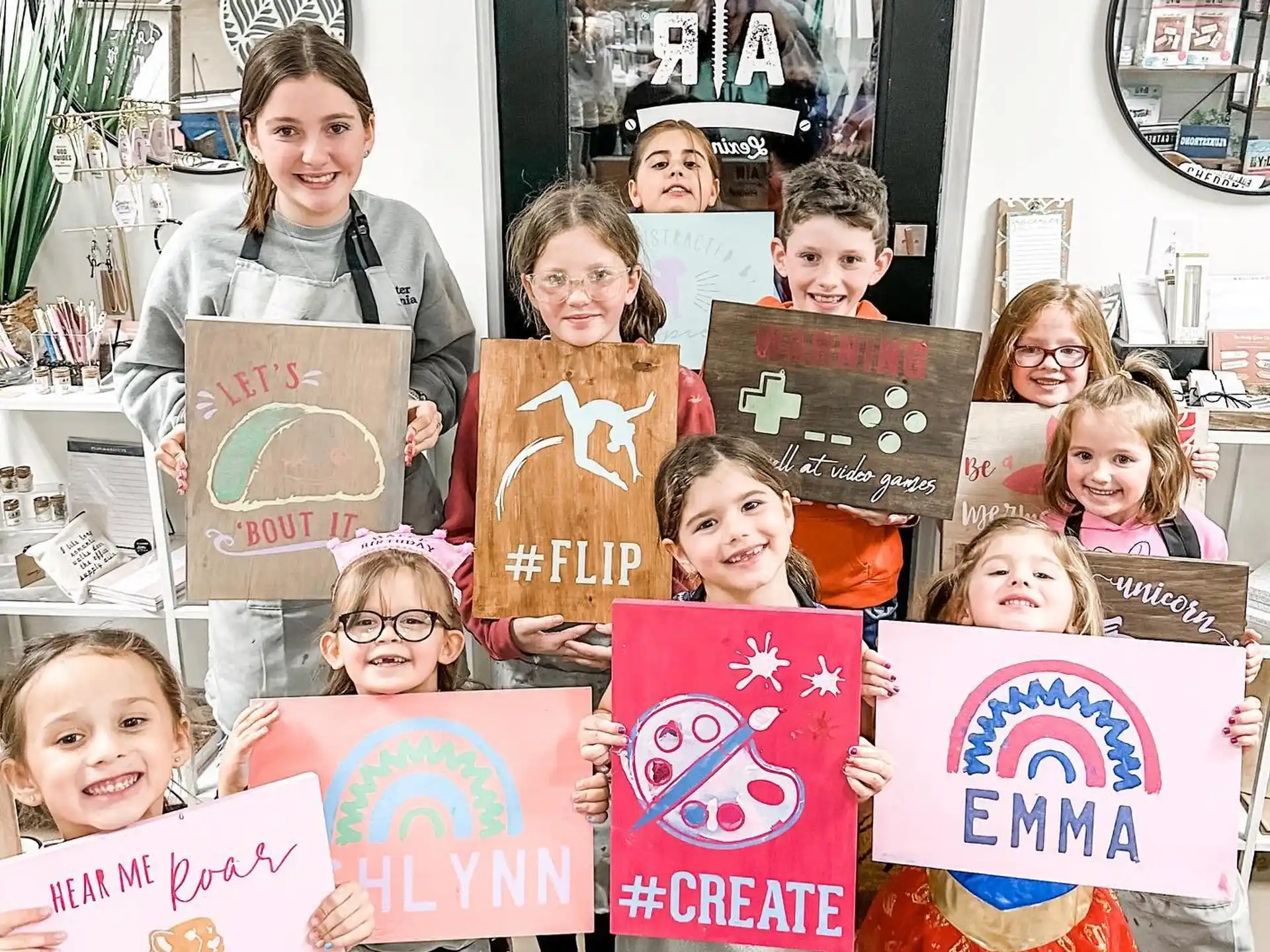 a group of children holding signs