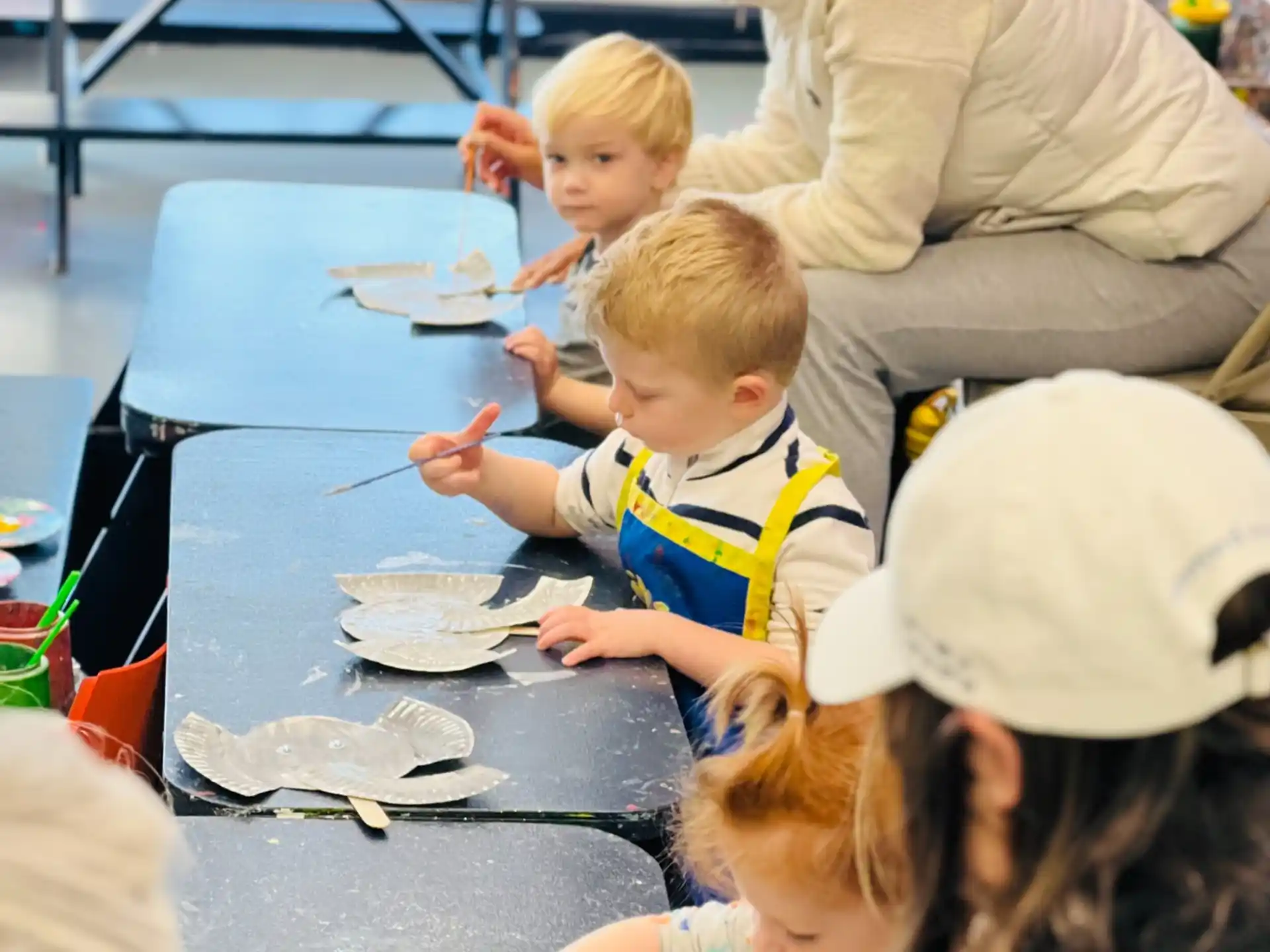 a person and children painting