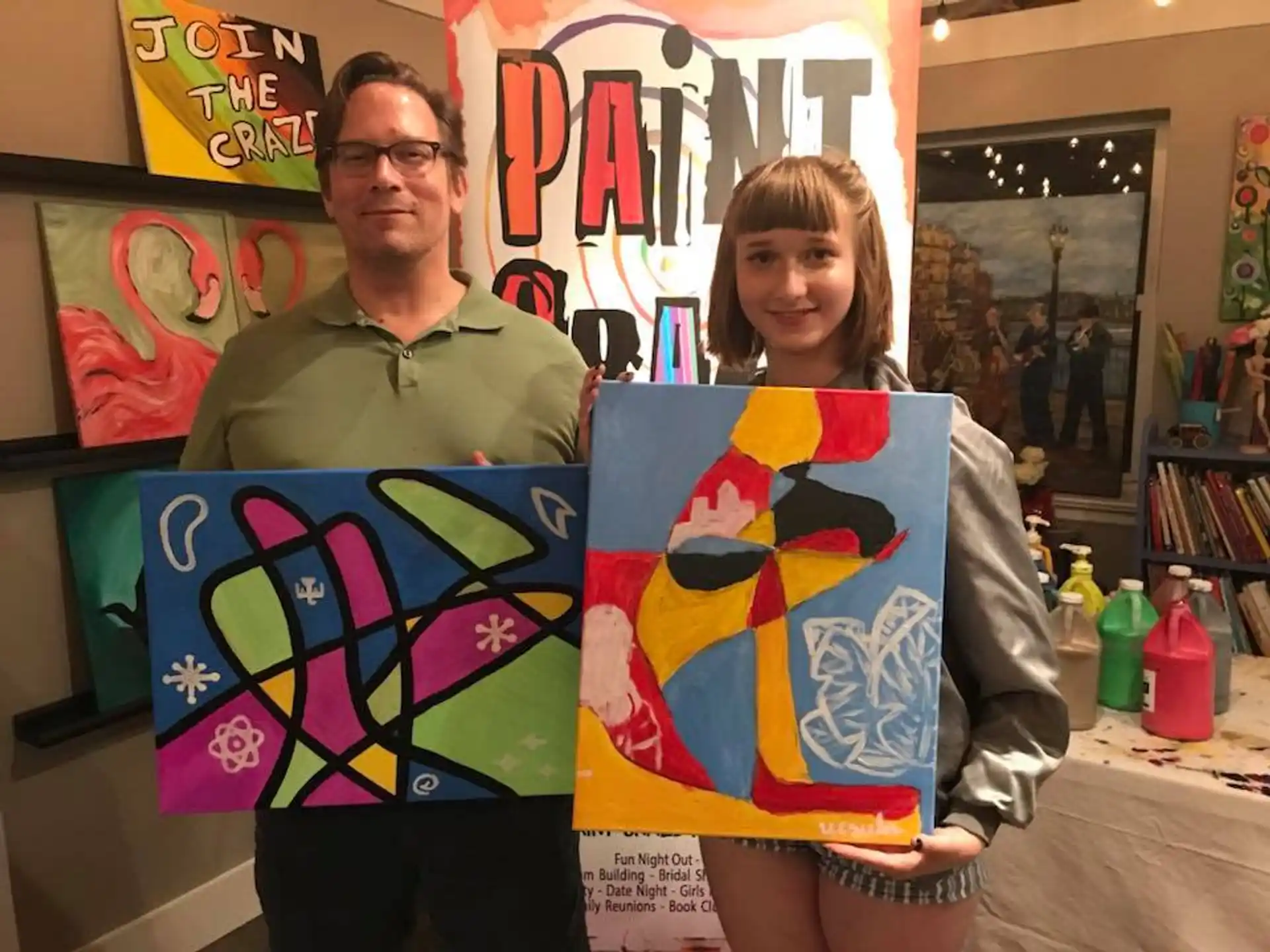 a man and a woman holding a poster