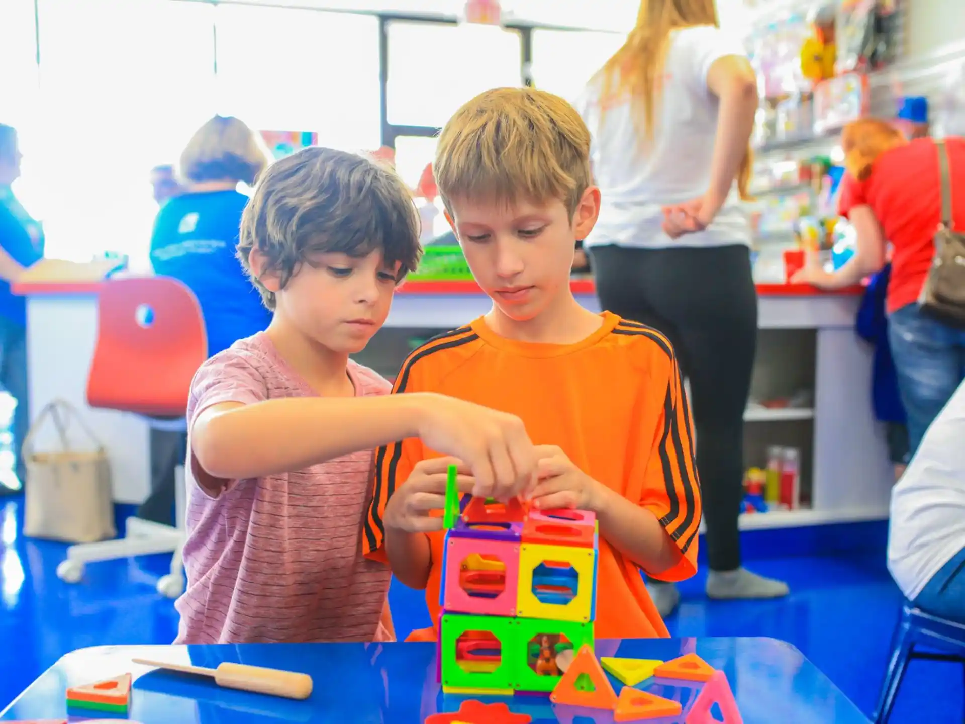 a couple of boys playing with toys