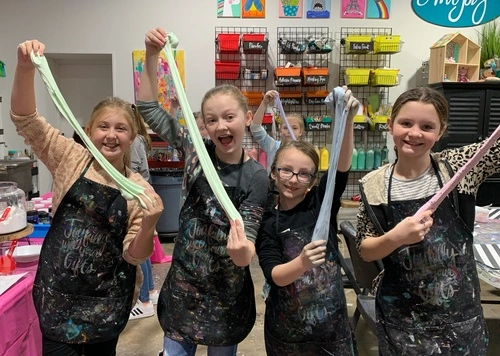 a group of people holding sticks