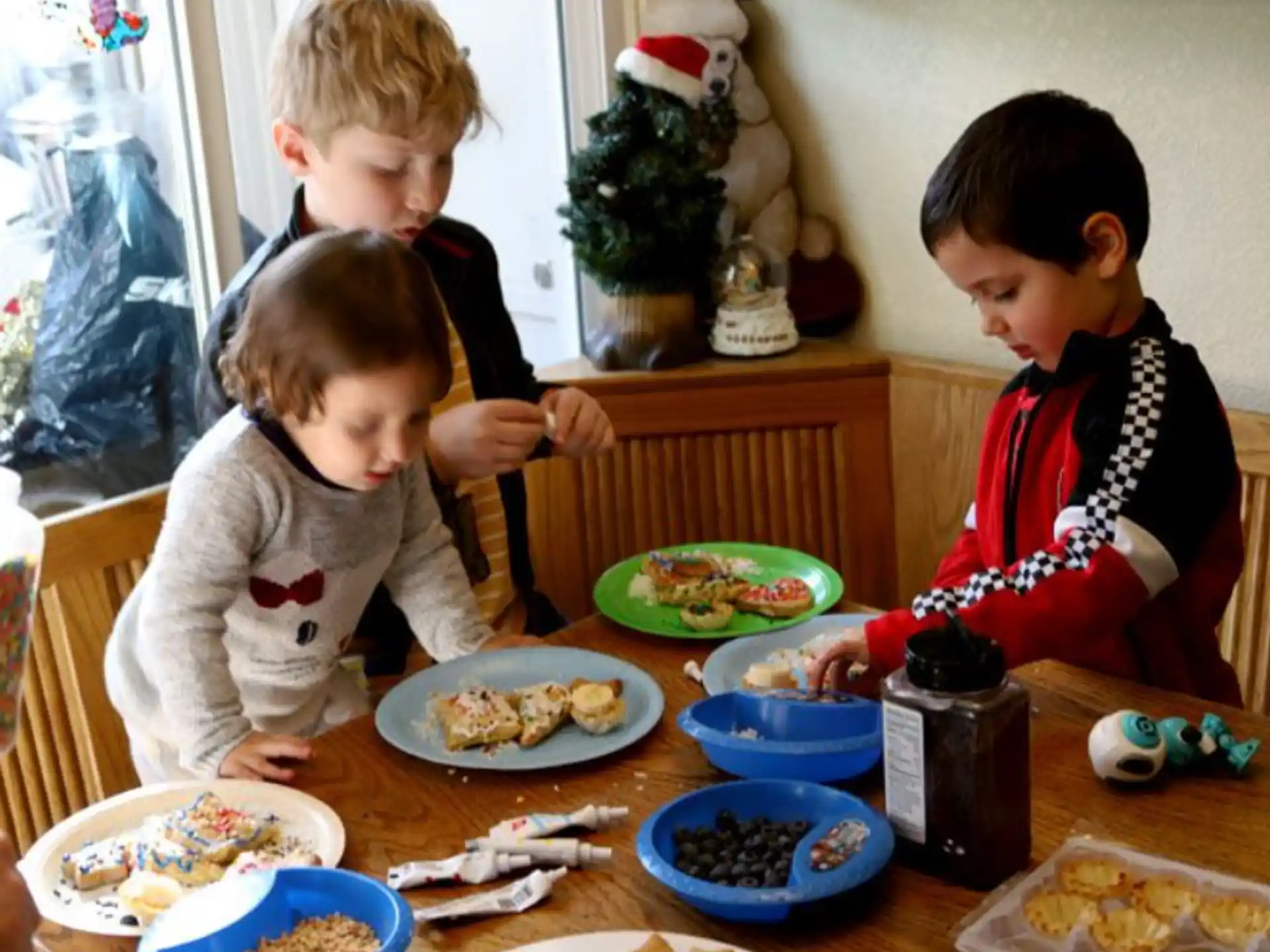 a couple of kids eating at a table