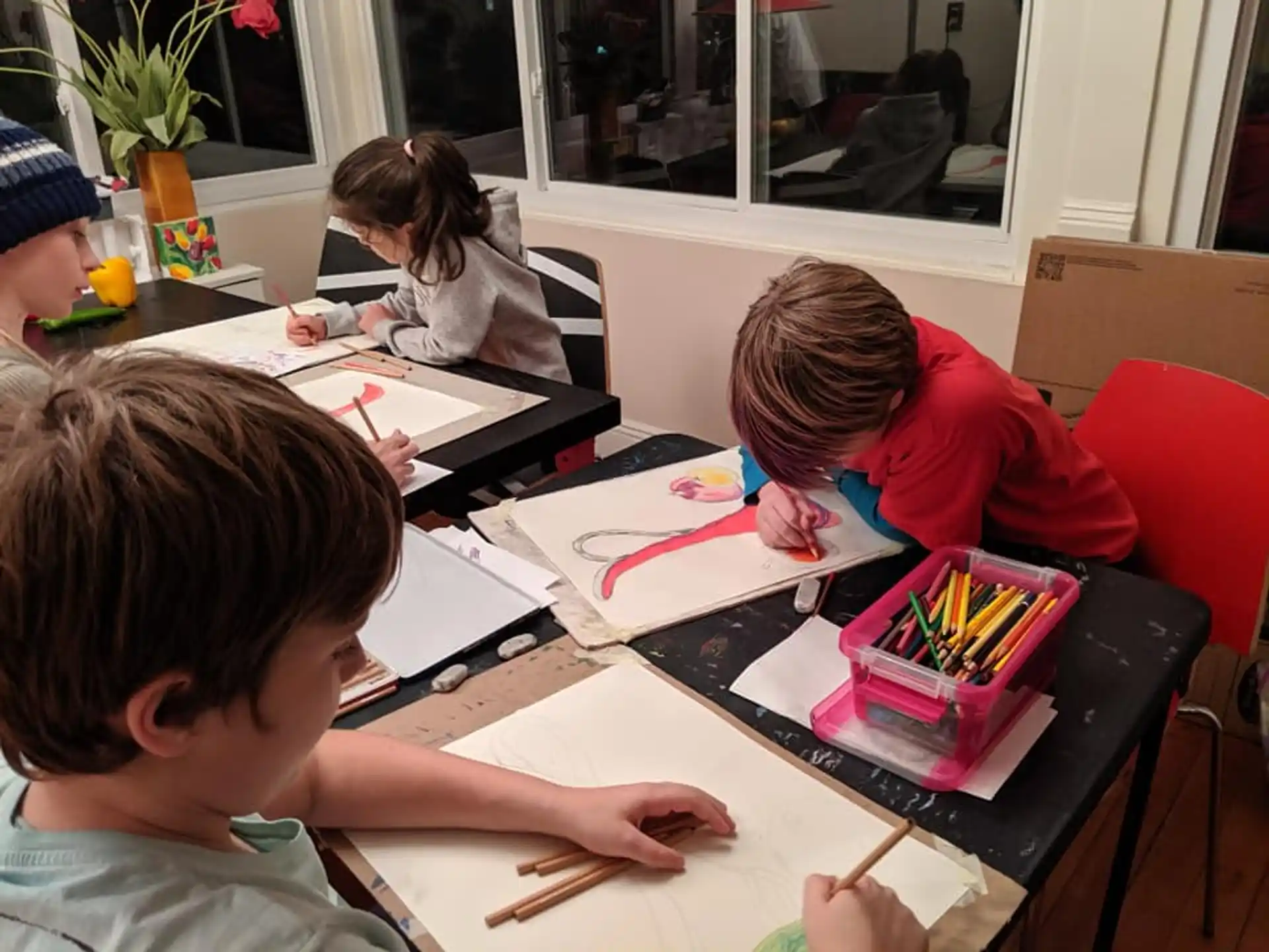 a group of children sitting at a table