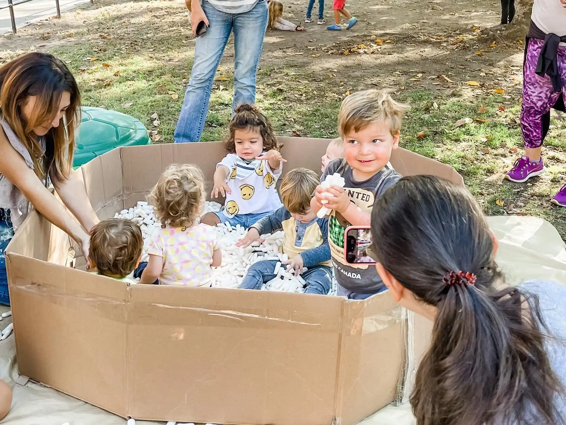 a group of children sitting in a box