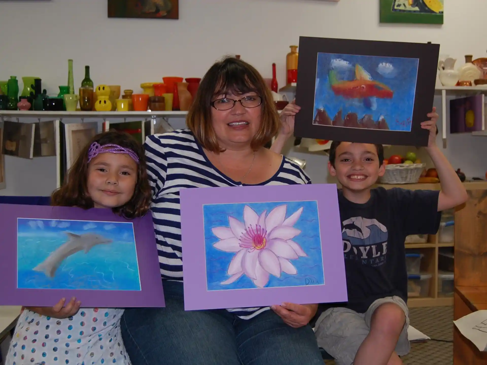 a person and two children sitting on a couch