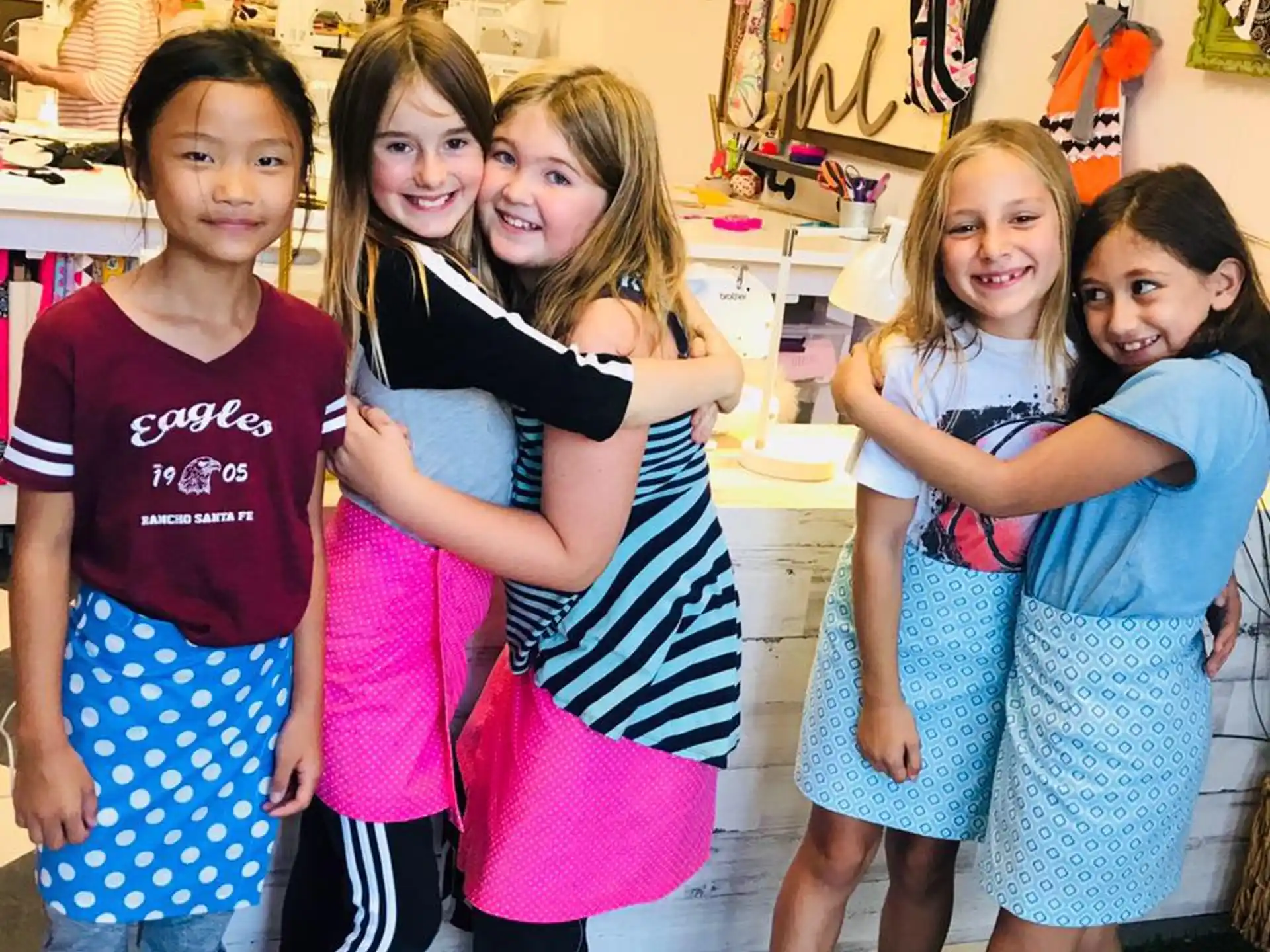 a group of girls posing for a photo