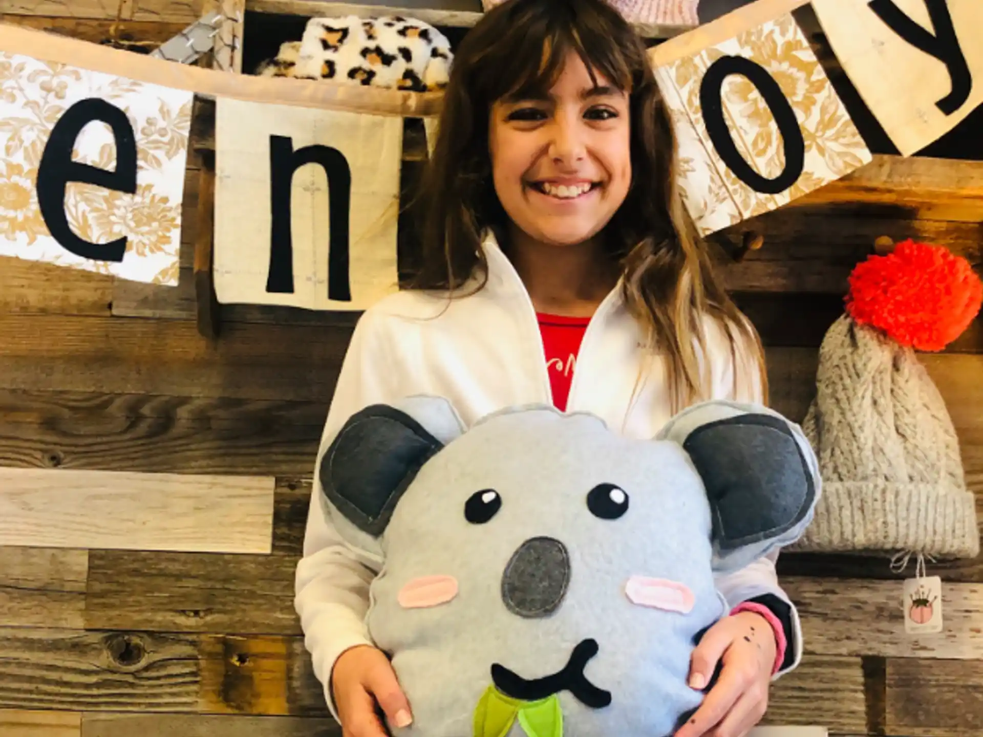 a person holding a stuffed animal