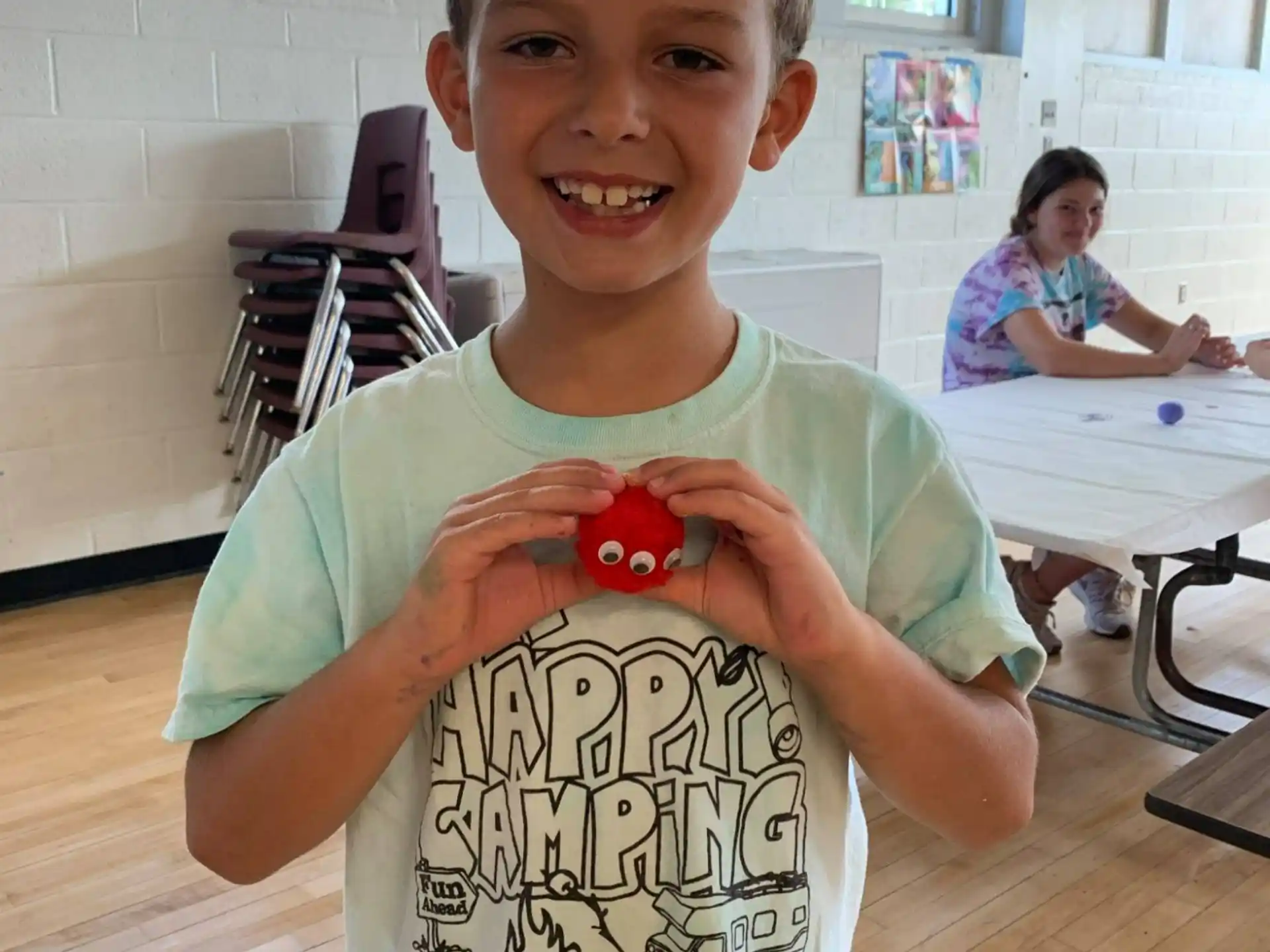 a boy smiling for the camera