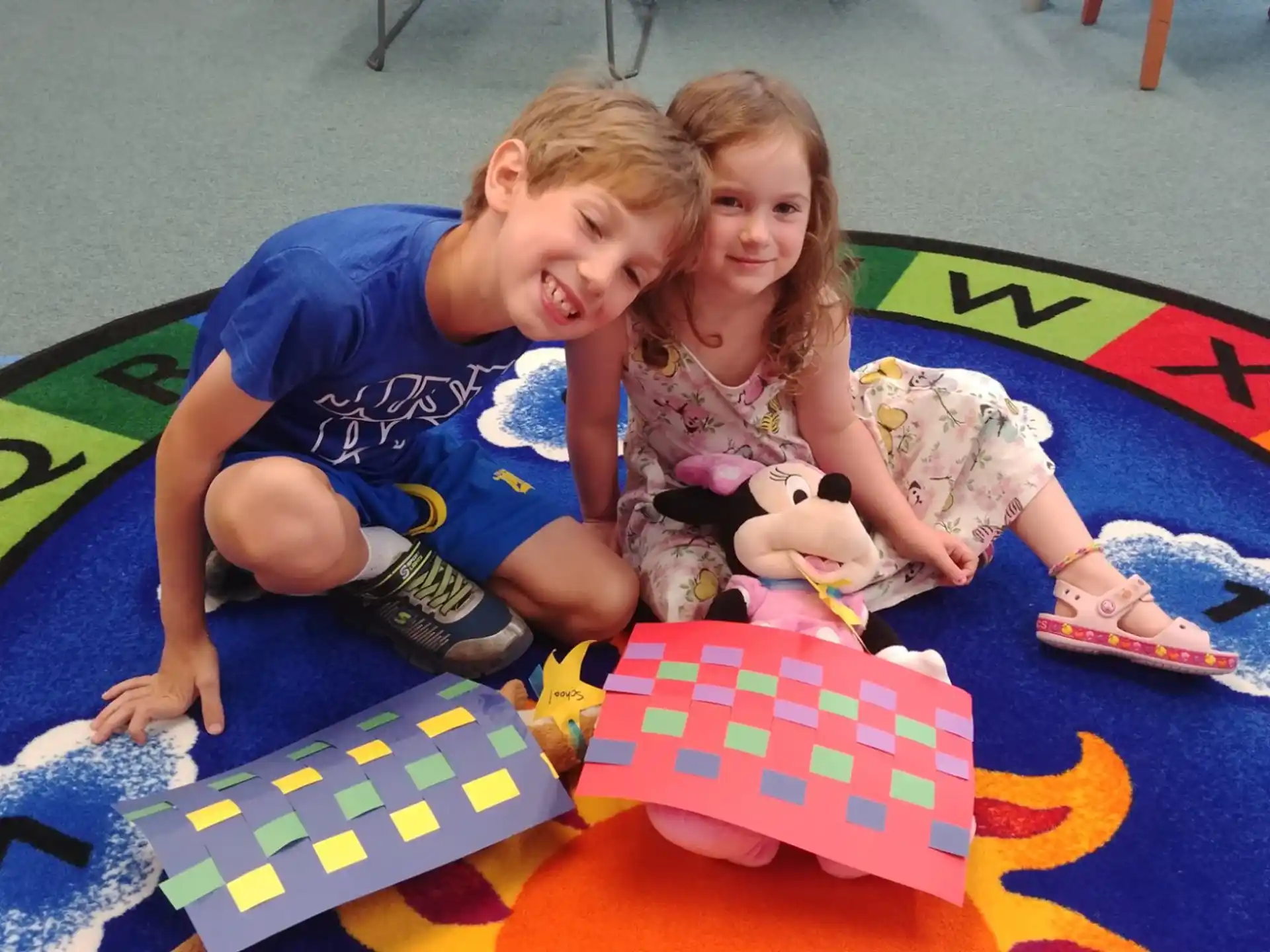 a couple of children playing on a mat